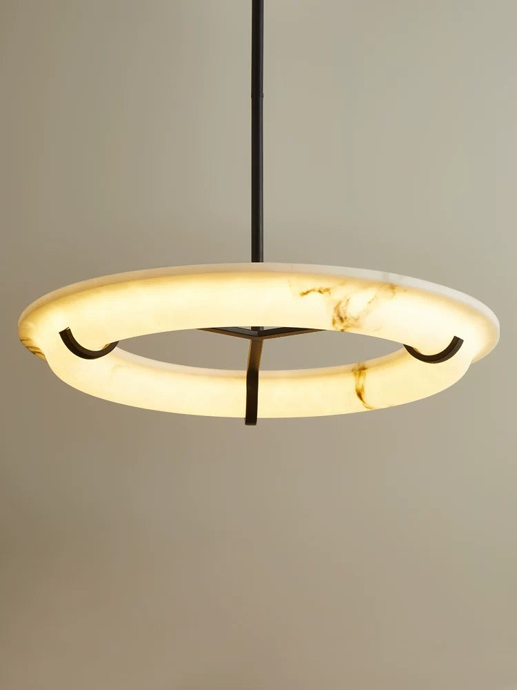 Sorano circular marble ring chandelier showcasing smooth stone halo and architectural suspension