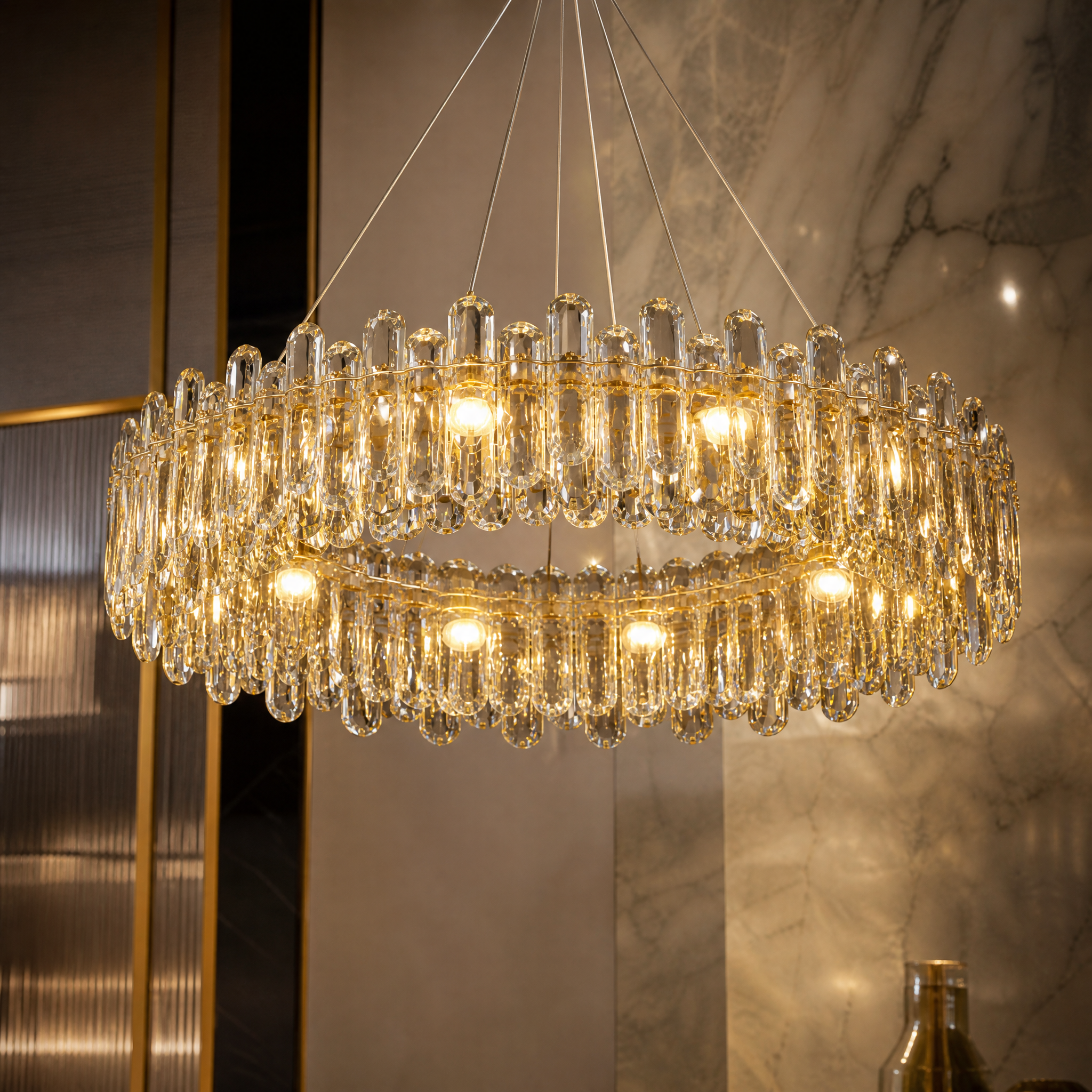 Macro closeup of the oblong textured crystal perimeter on the VORELLI Stellina circular chandelier.