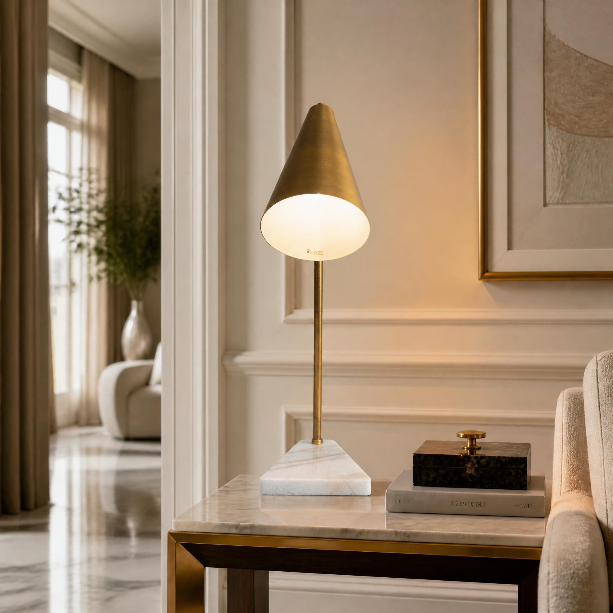 VORELLI Strava antique brass table lamp with adjustable head illuminating a sophisticated residential home office desk with modern luxury decor.