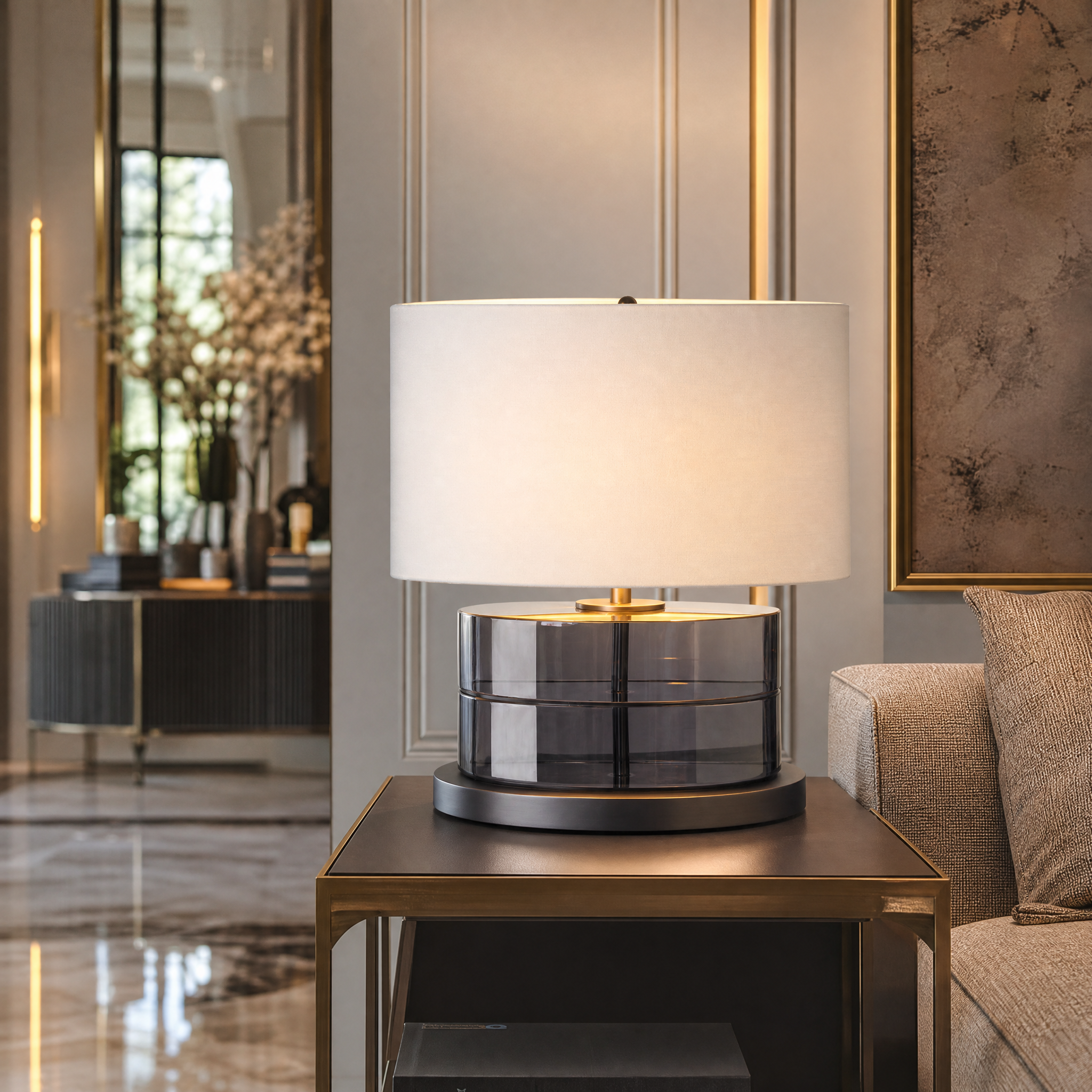 A luxury Tarnell gunmetal smoke table lamp by VORELLI styled on a contemporary living room side table, casting a warm ambient glow.