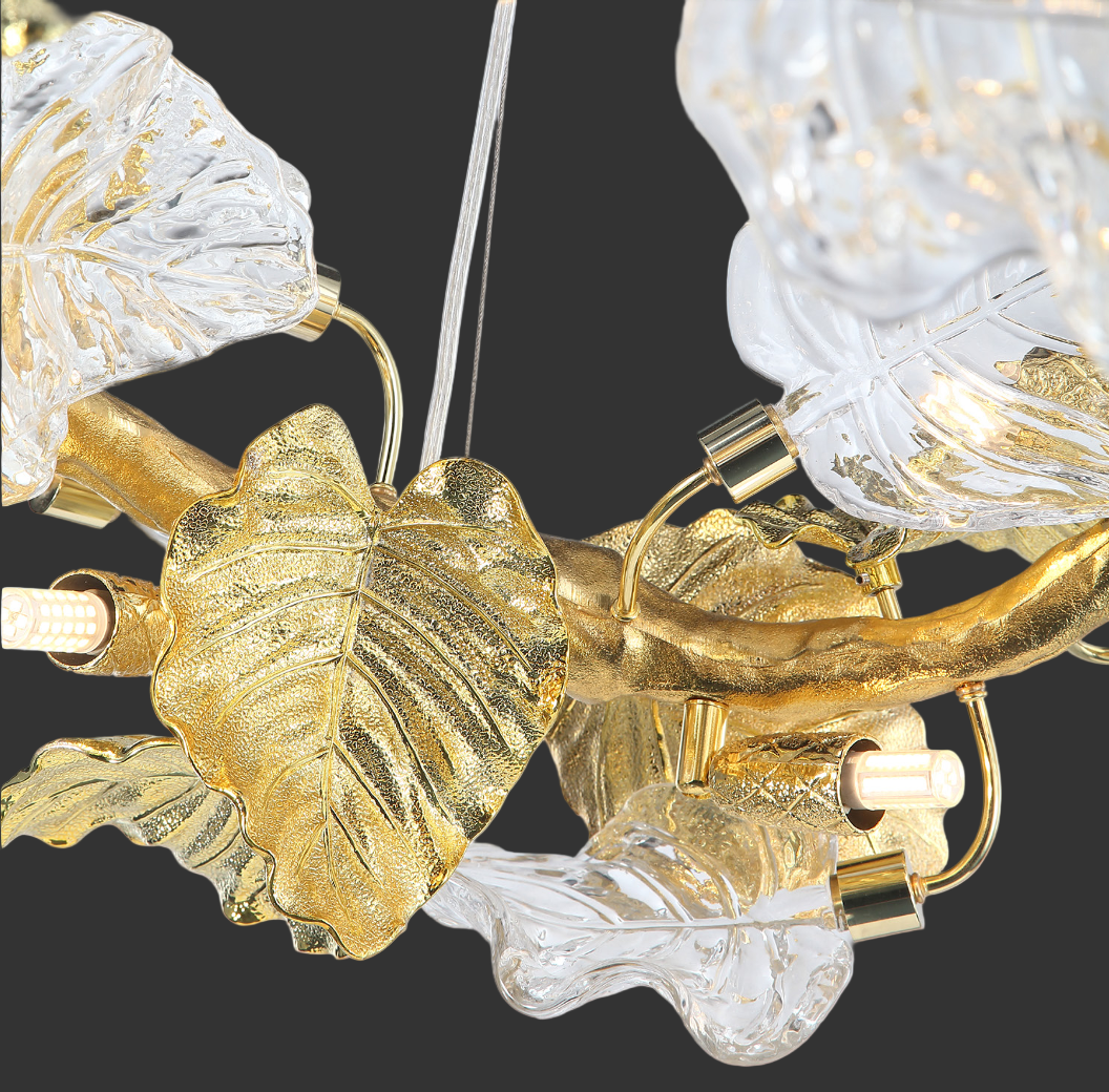 The Aura Leaf Linear Staircase Chandelier II casting a warm, luxurious glow, creating a dramatic and elegant mood in a grand interior.