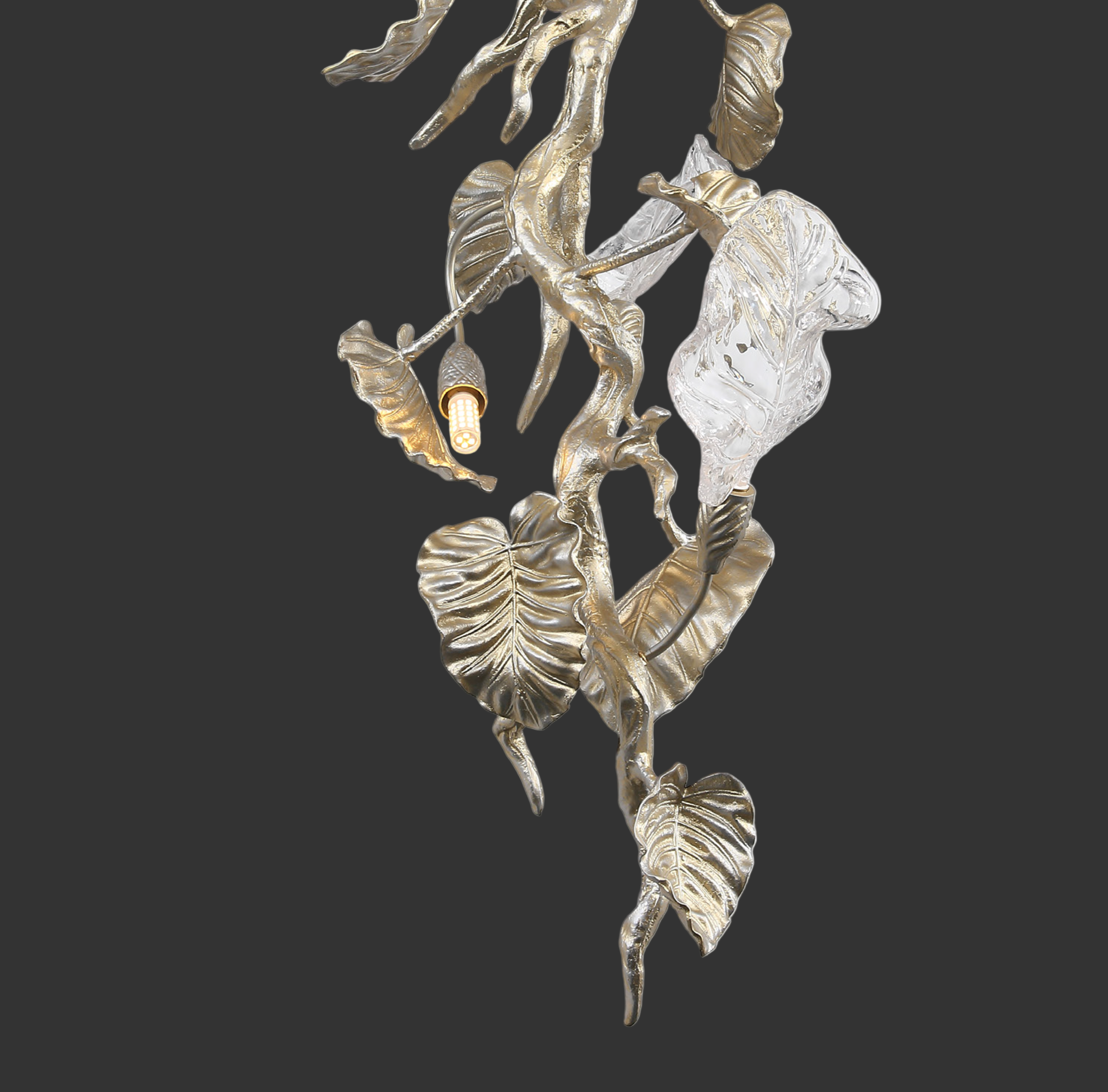 The grand, sculptural vertical flow of the Aura Leaf Linear Chandelier accentuating a high-ceiling luxury entryway space.