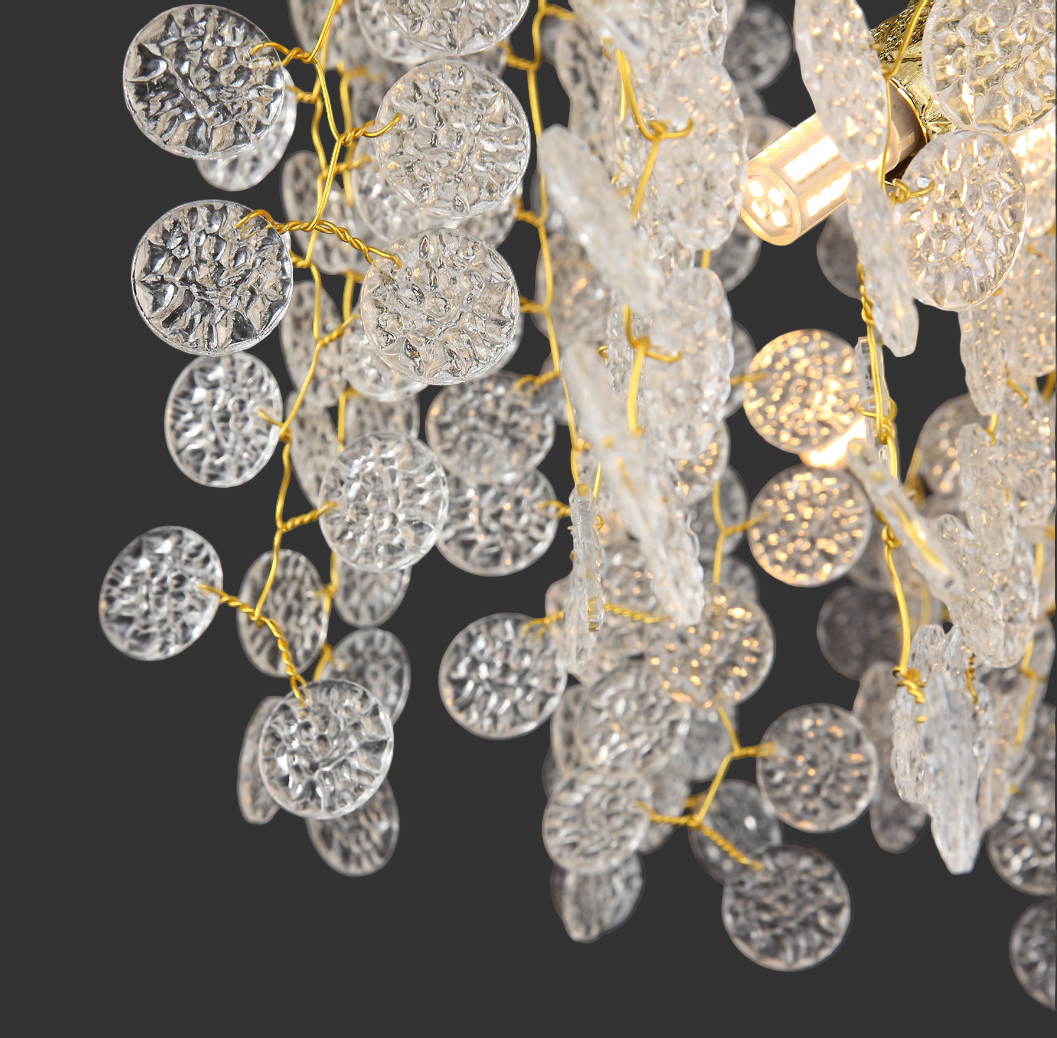 The Lunaria chandelier viewed from below, highlighting the rhythmic pattern and ethereal texture of the hanging crystal discs.
