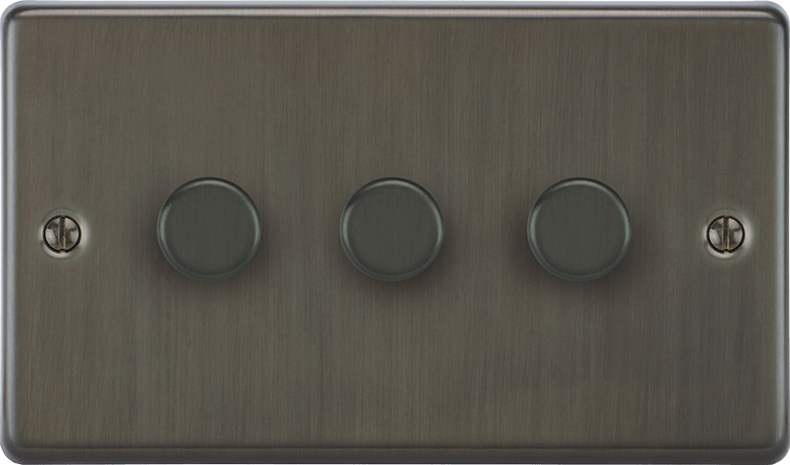 The Victorian dimmer switch displayed against a dark moody wall for contrast.