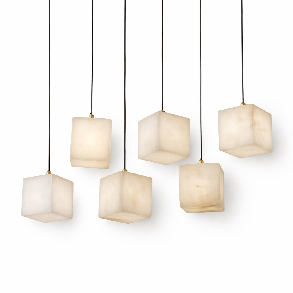 The VORELLI Cubetto marble pendant light emitting a serene, translucent glow that accentuates its clean, minimalist lines and premium organic textures.
