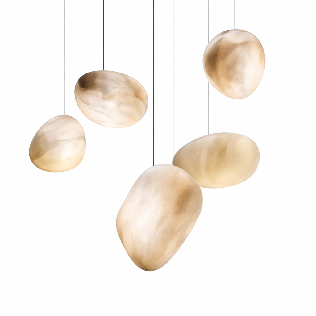 The VORELLI Sassi Marble Pendant Light showcasing its organic pebble shape and timeless strength, evoking a sophisticated architectural mood.