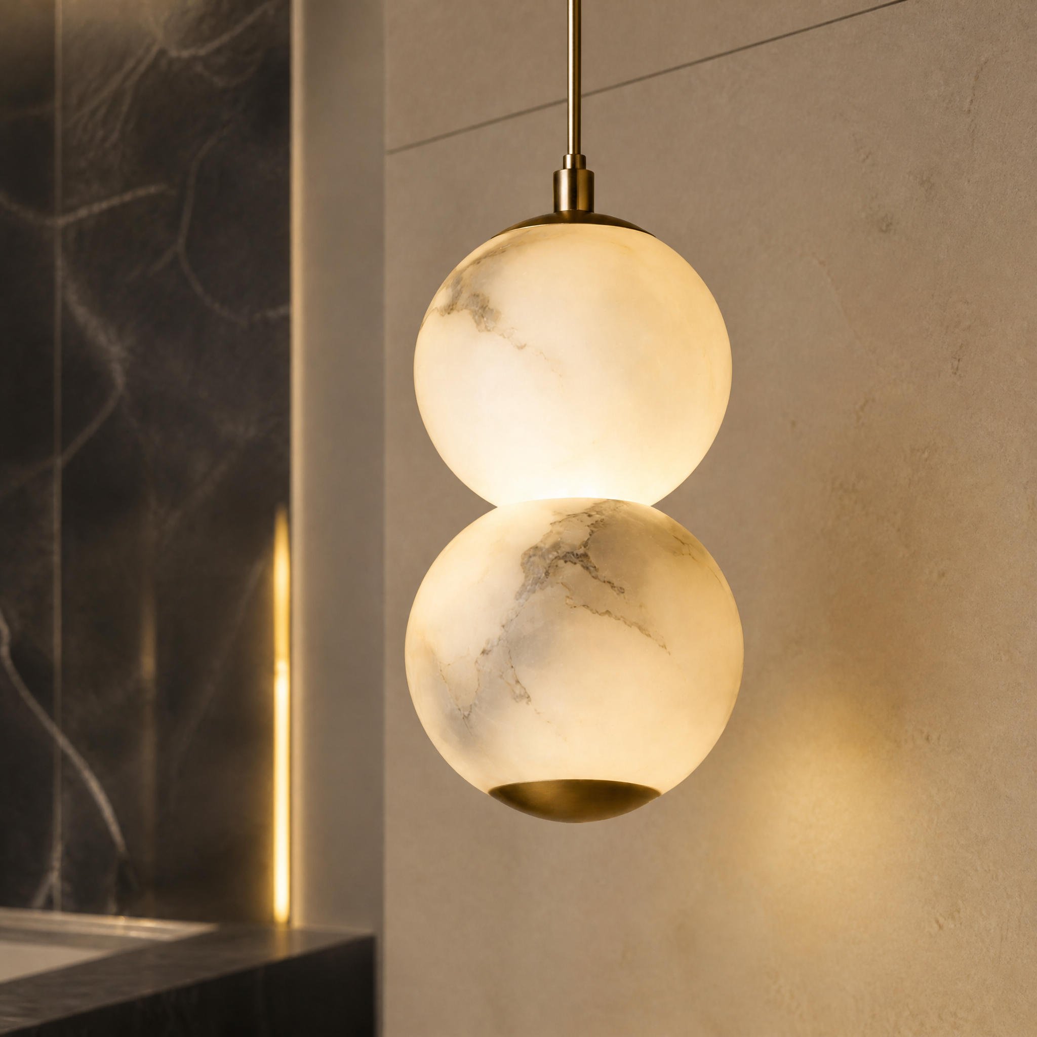 A detailed closeup shot of the VORELLI Thea Marble Pendant Light showcasing the architectural harmony and texture of the glowing marble spheres.