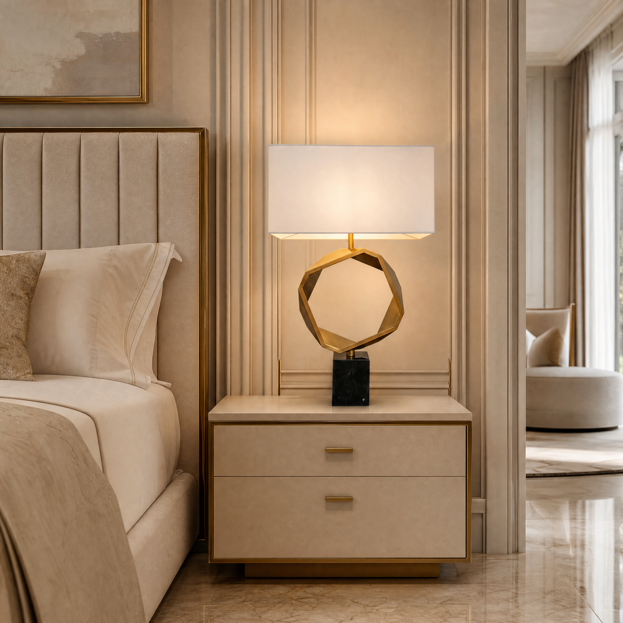 VORELLI Torvello brass marble table lamp illuminating a luxury residential living room setting with a warm, sophisticated ambient glow.