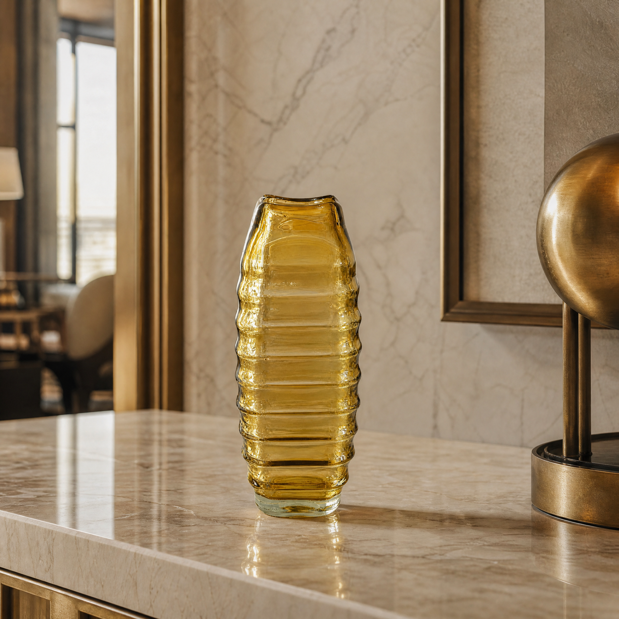 The Valdese small tinted yellow glass vase used as an elegant decorative detail in a high-end boutique hotel suite.