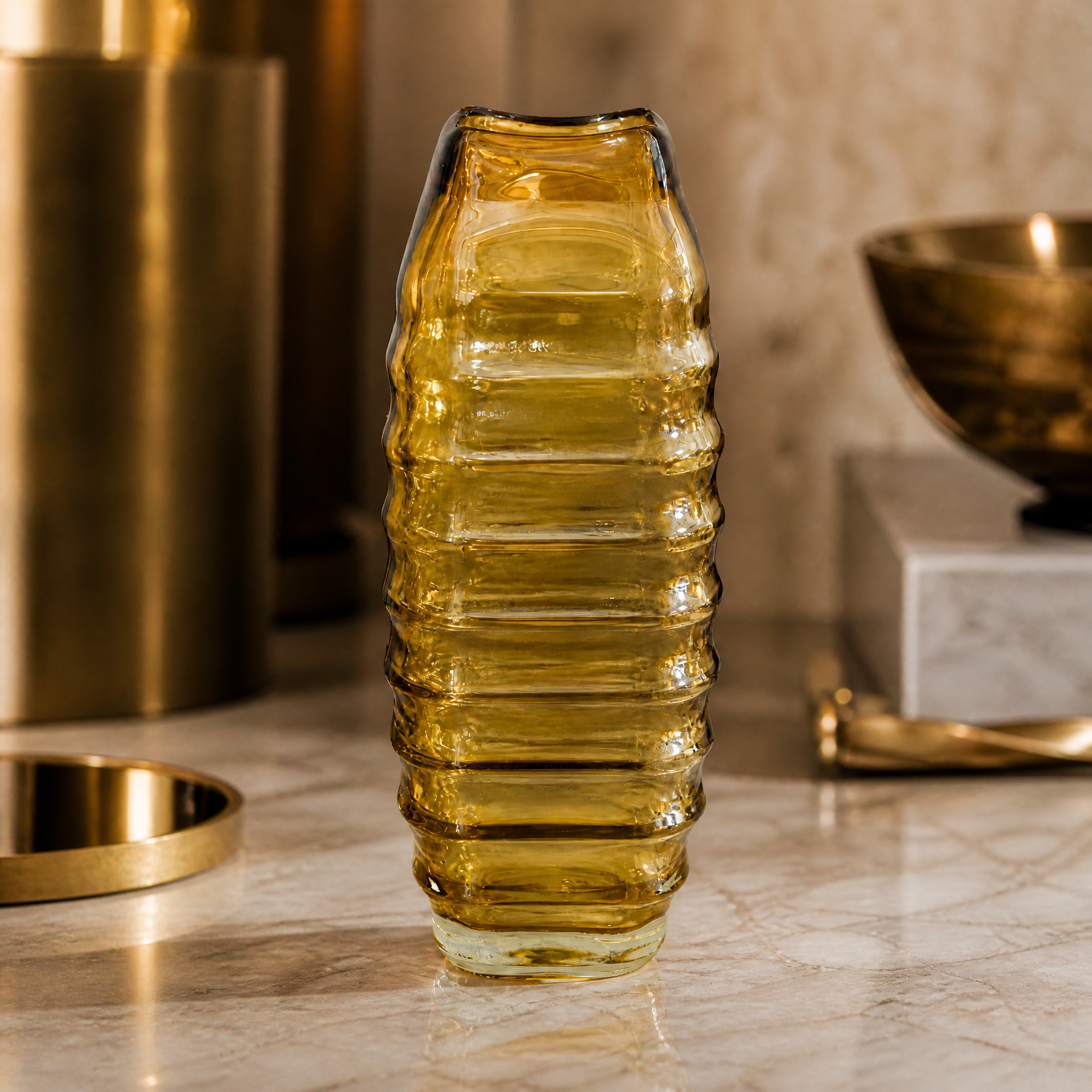 Detail view of the Valdese small vase showing the intricate ribbed surface texture and light-diffusing yellow glass.