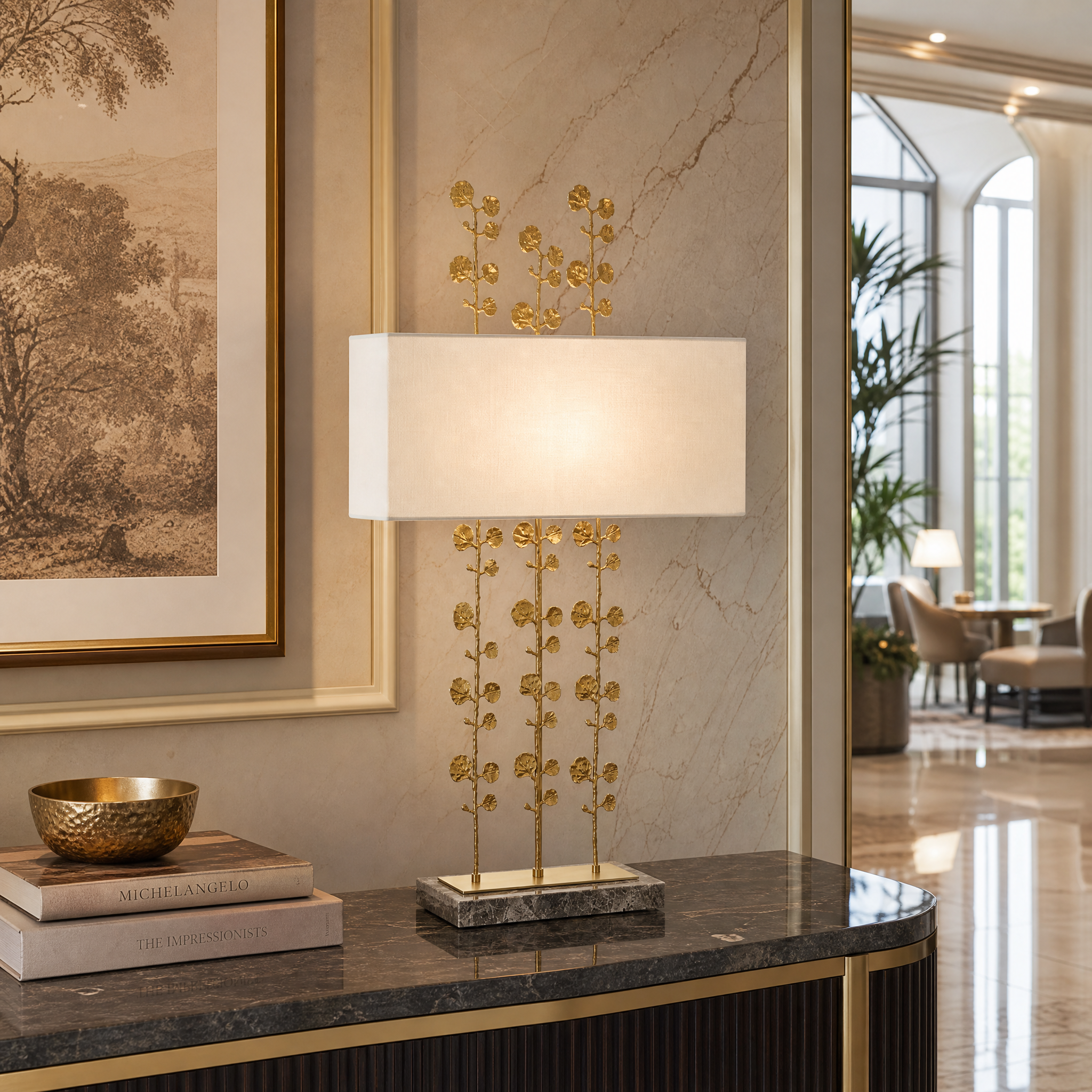 The sculptural Valenza brass table lamp adding sophisticated ambient lighting to a high-end hospitality lobby.