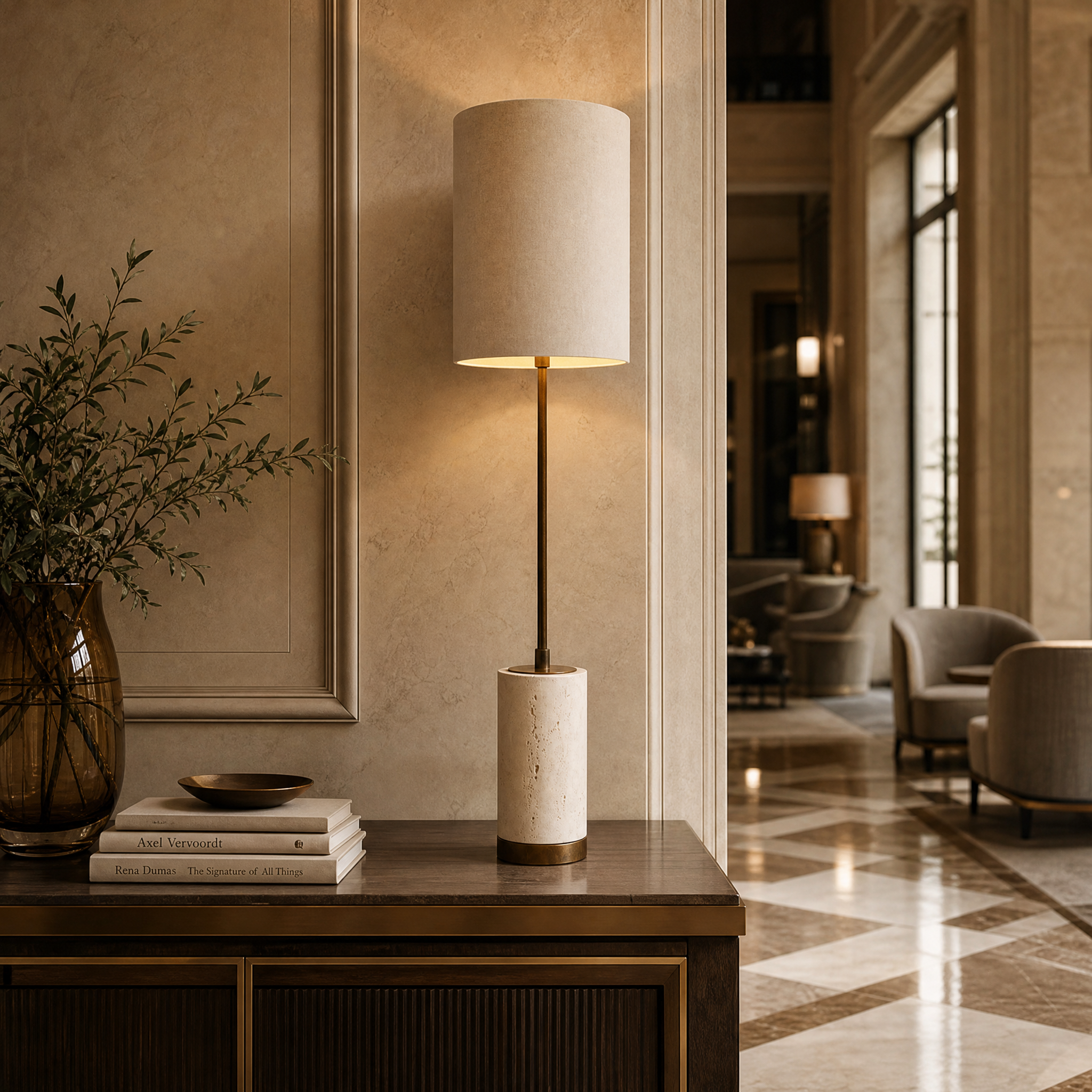 Elegant Valmere H79 architectural table lamp by VORELLI styled in a luxury hospitality bedroom setting, showcasing its refined antique brass stem.