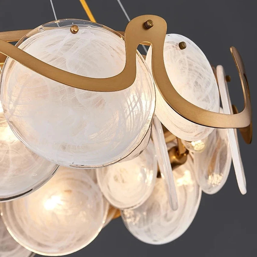 Close-up detail of Valparaiso Cristóbal chandelier showing hand-blown glass discs and elegant sculptural metal frame