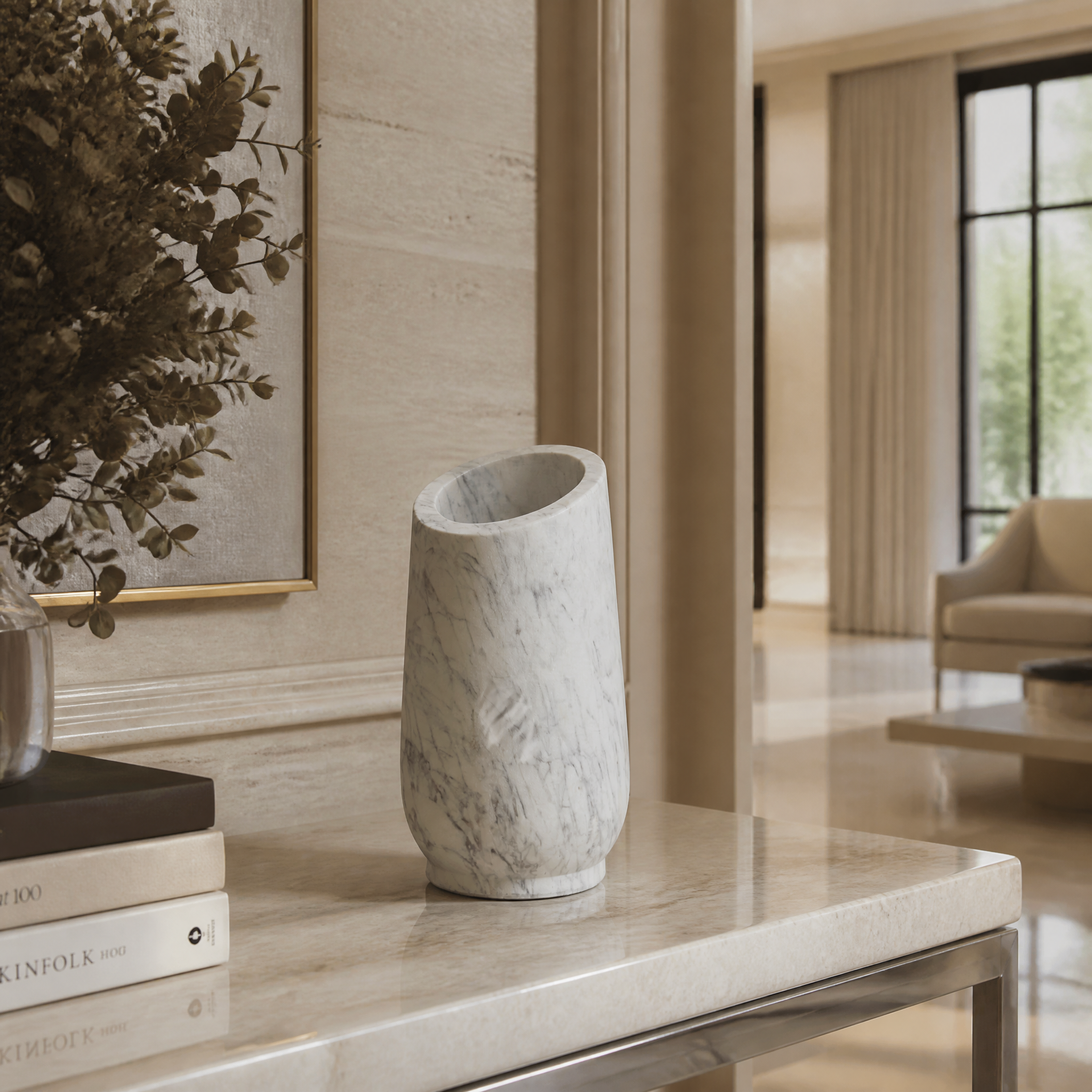 Marello polished white marble vase with an angled top displayed on a contemporary living room coffee table.