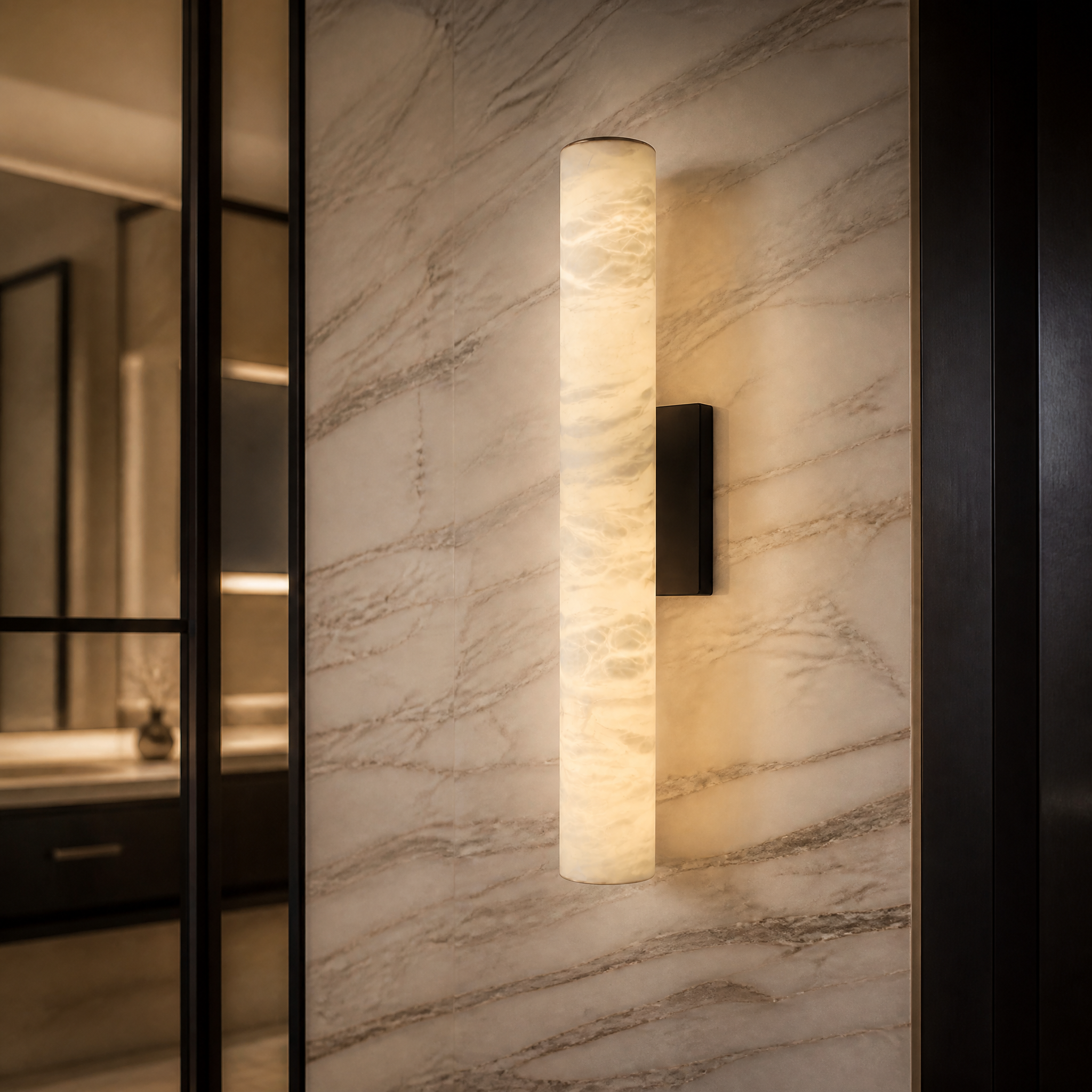 A detailed closeup of the VORELLI Velato wall light, showcasing the natural veins of the slender marble cylinder and its sleek black accents.