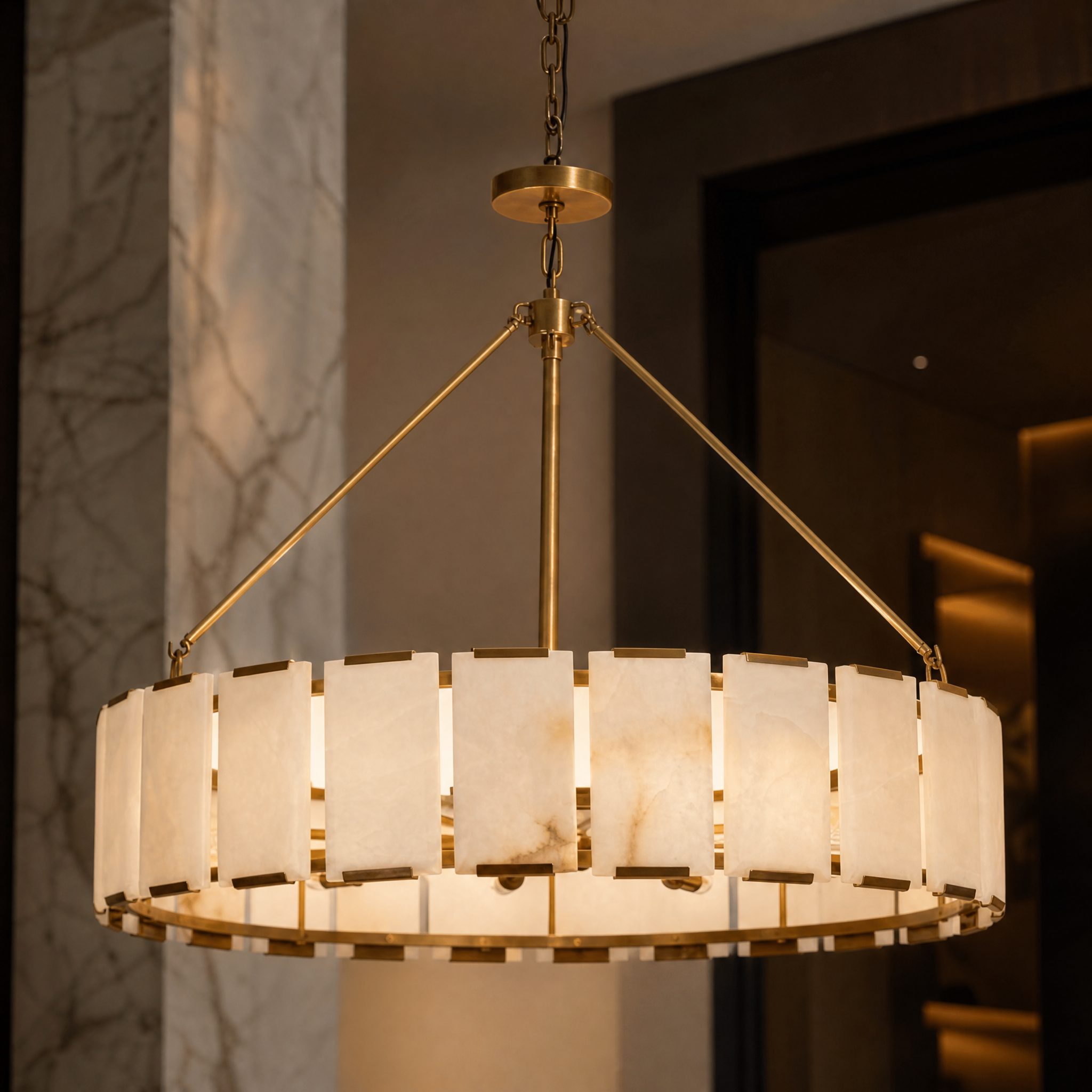 Detailed closeup of the Venezino Alabaster Chandelier showing the texture of the stone shade against industrial-style brass accents.