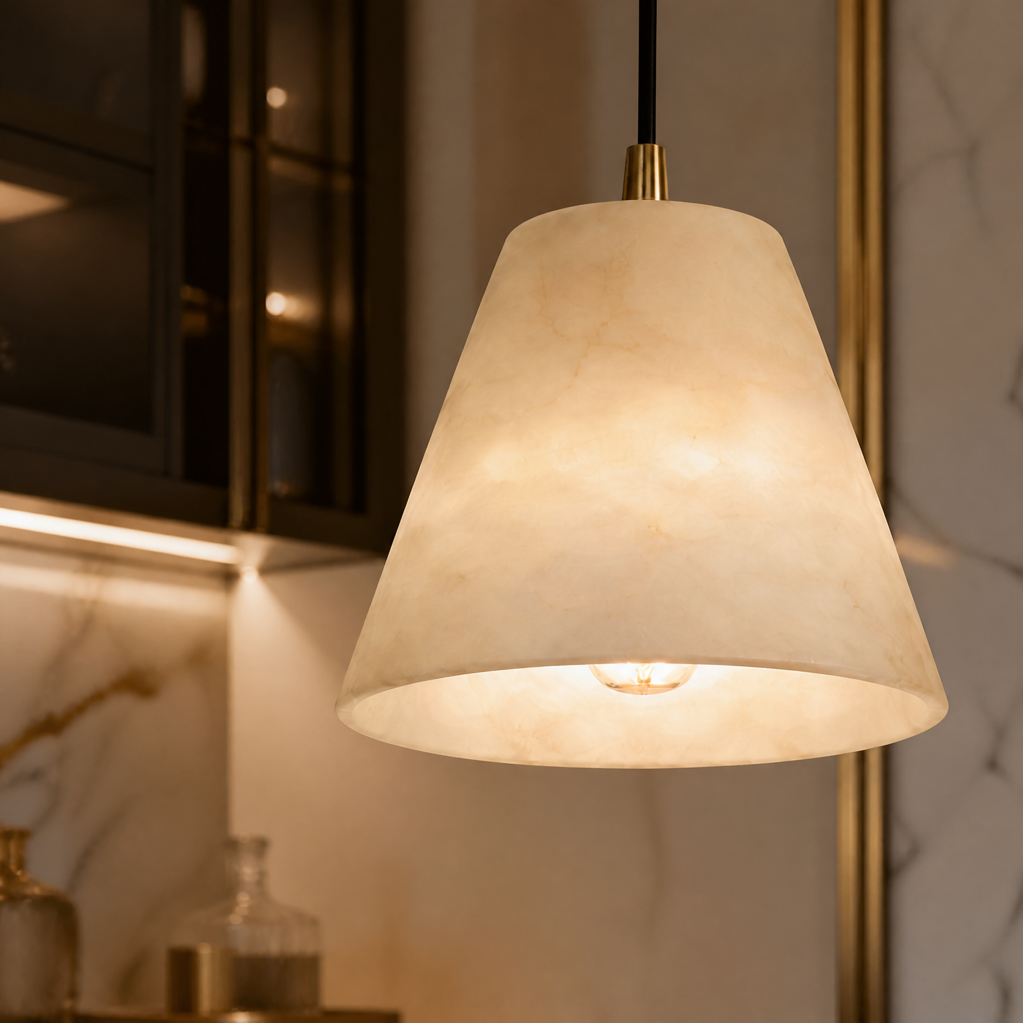 A detailed closeup of the VORELLI Venti pendant light highlighting the natural veining of the sculpted marble and its refined conical design.