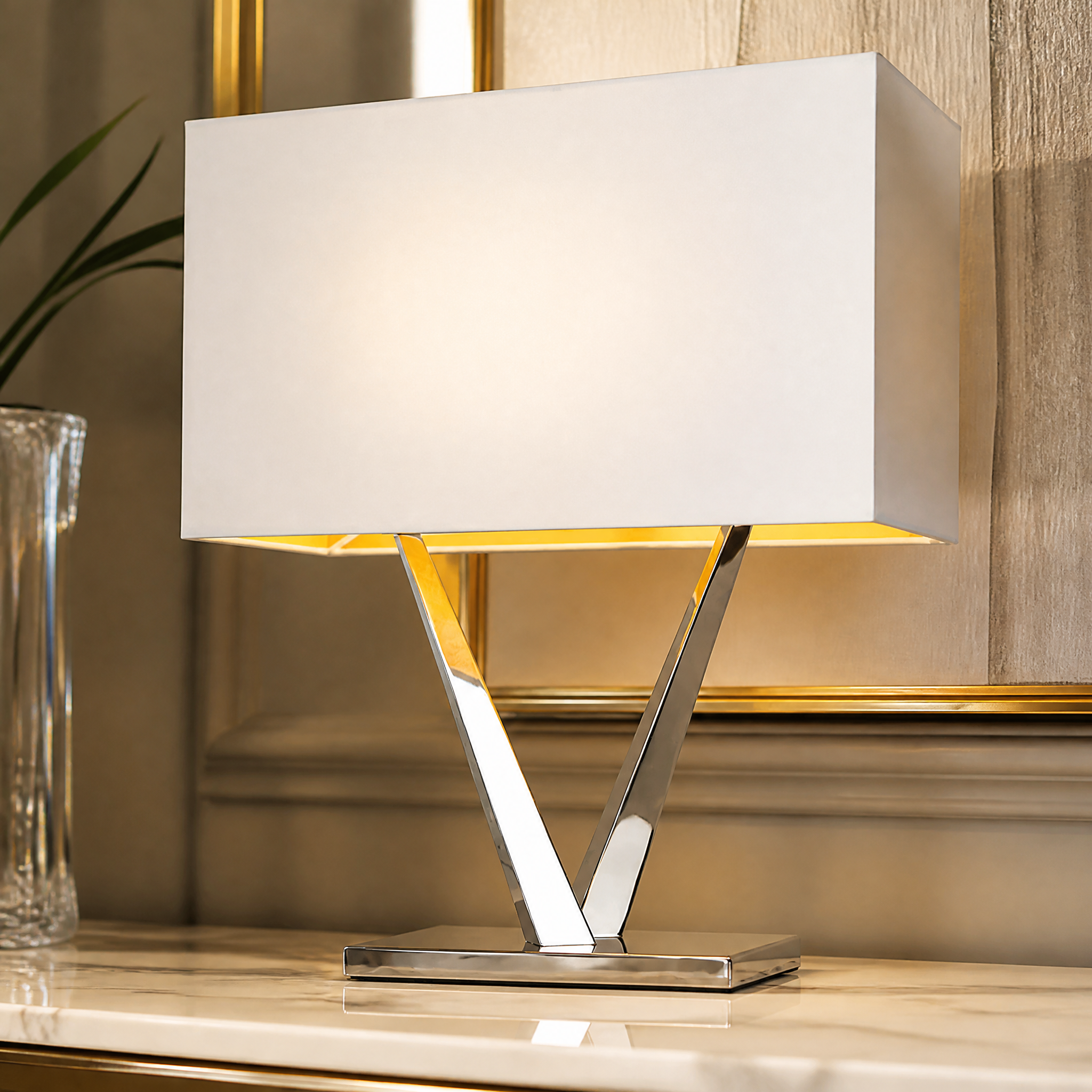 Close up detail of the polished nickel frame and off-white structured shade on the Virello table lamp