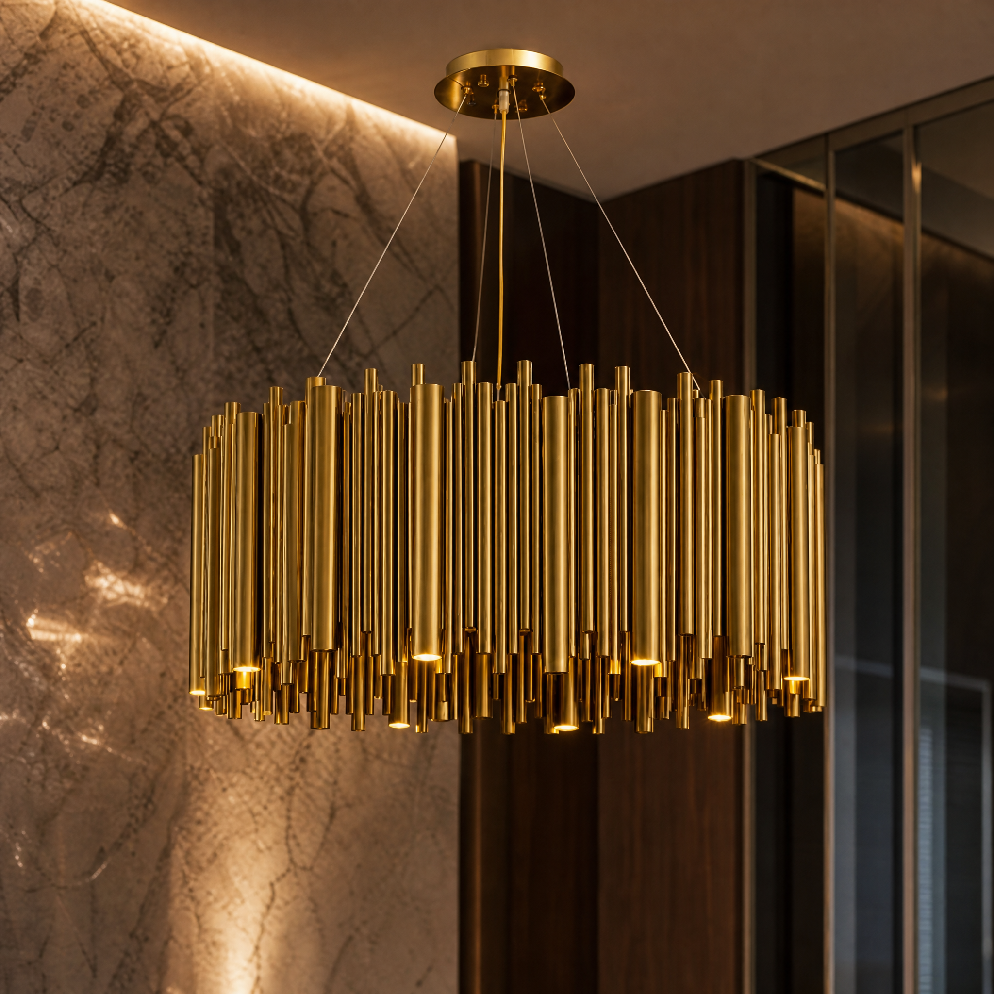 Macro detail shot showing the elegant brushed copper finish and intricate cylinder tubing of the Vitacura circular chandelier.