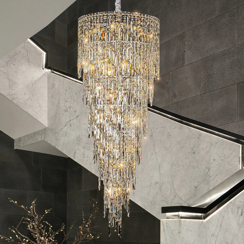 VORELLI® Abruzzi Spiral Staircase Chandelier suspended in a grand marble staircase setting