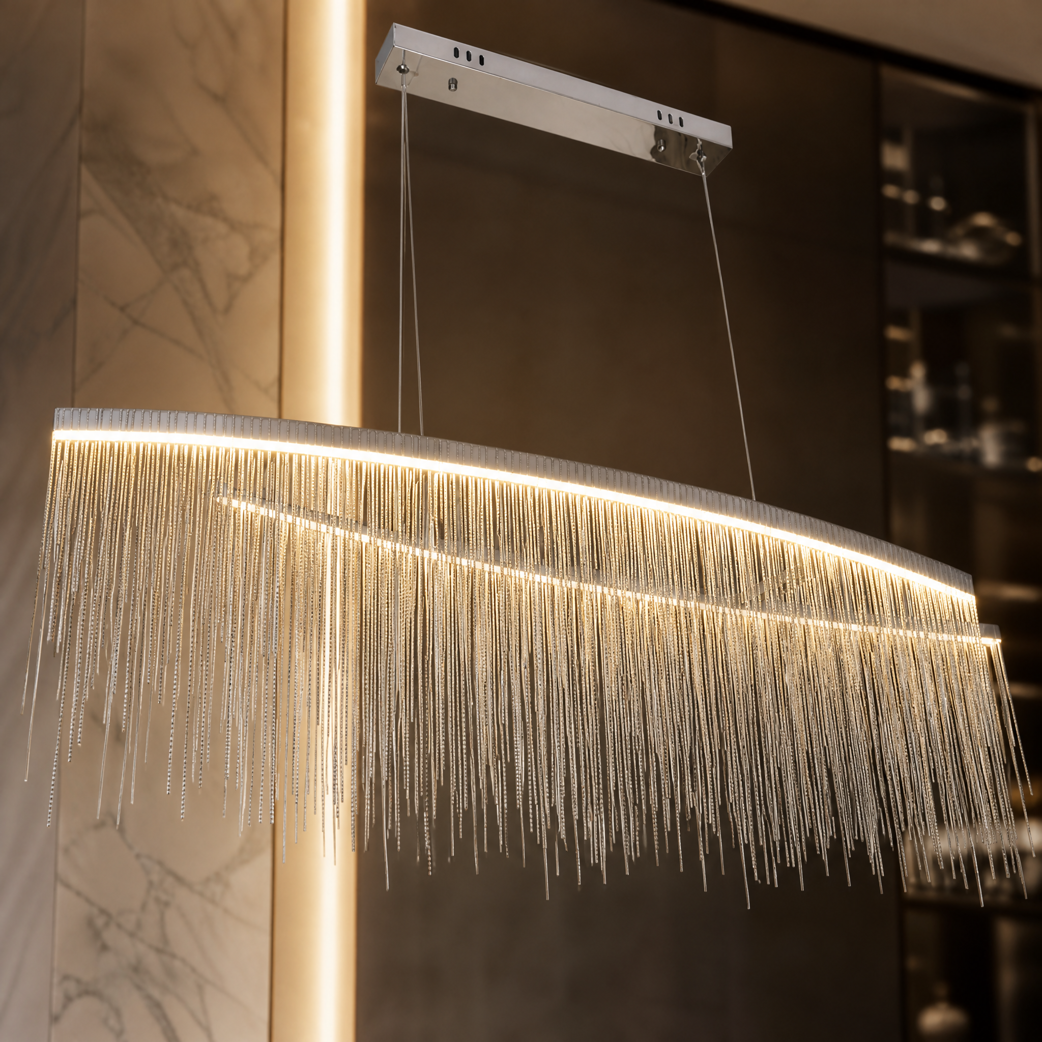 Close-up detail of the sleek arc frame and intricate cascading crystal chains on the VORELLI Adlington Arc Rectangular Chandelier.