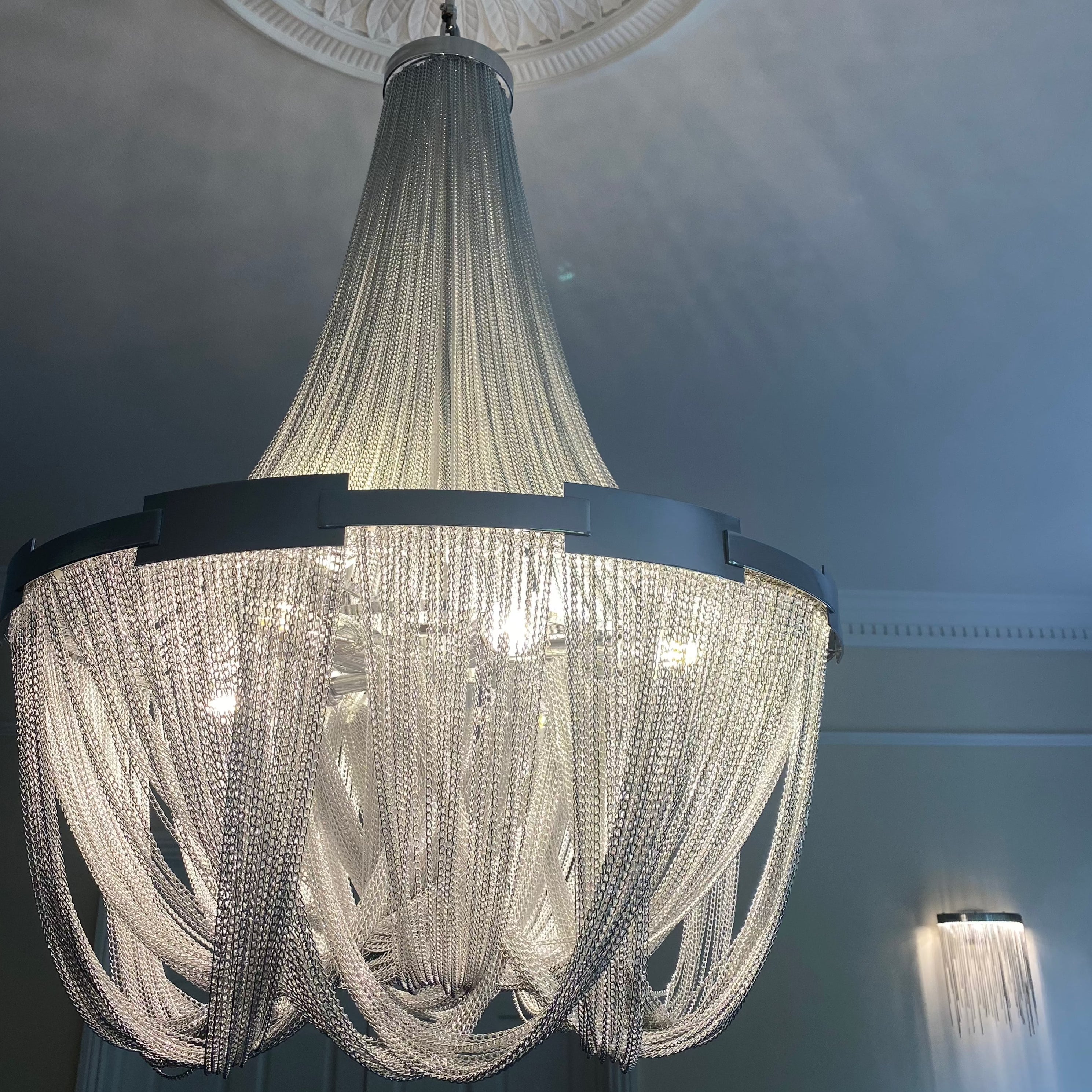 Side view of VORELLI® Adlington Wall Light showing modern elegance and chain texture