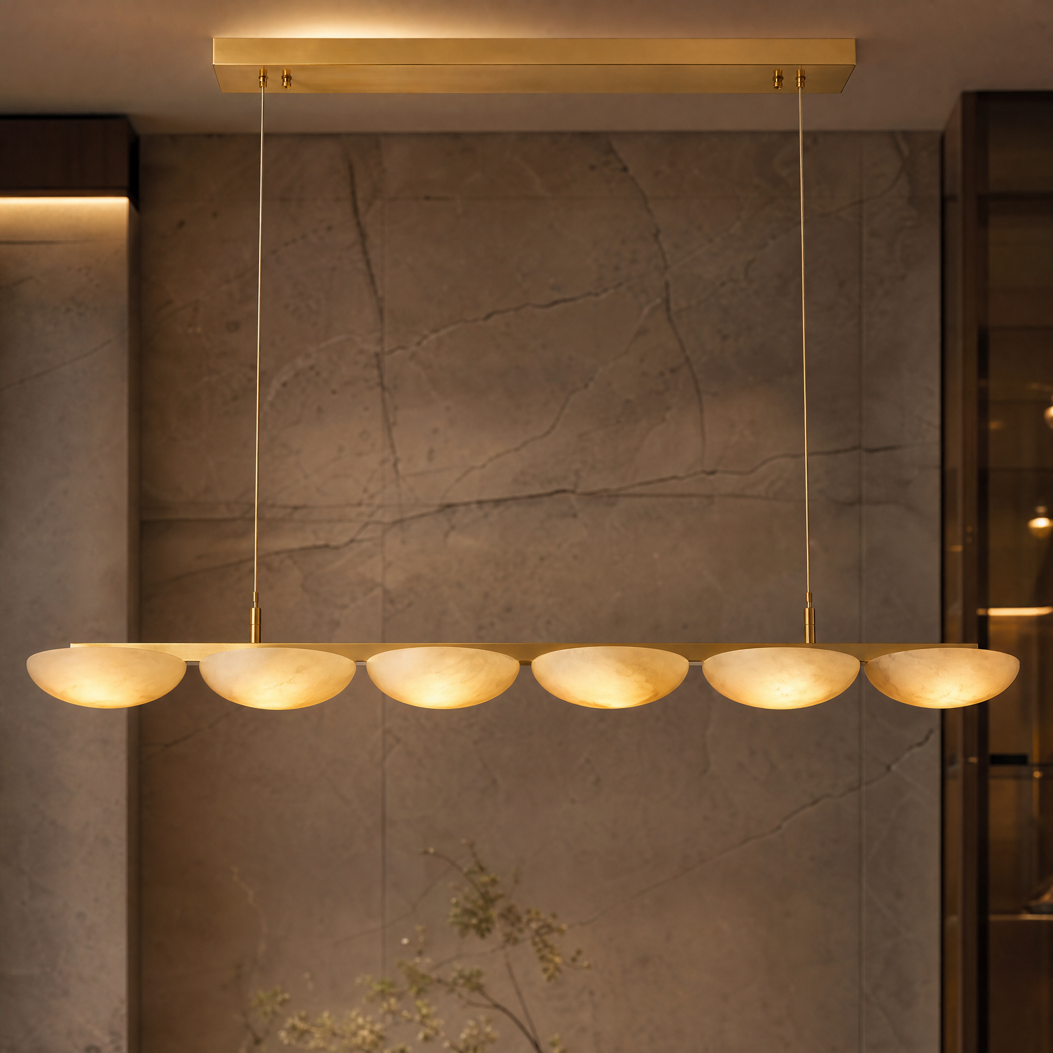 A macro close-up view of the smooth marble half-spheres and premium finish of the VORELLI Alba Rectangular Chandelier.