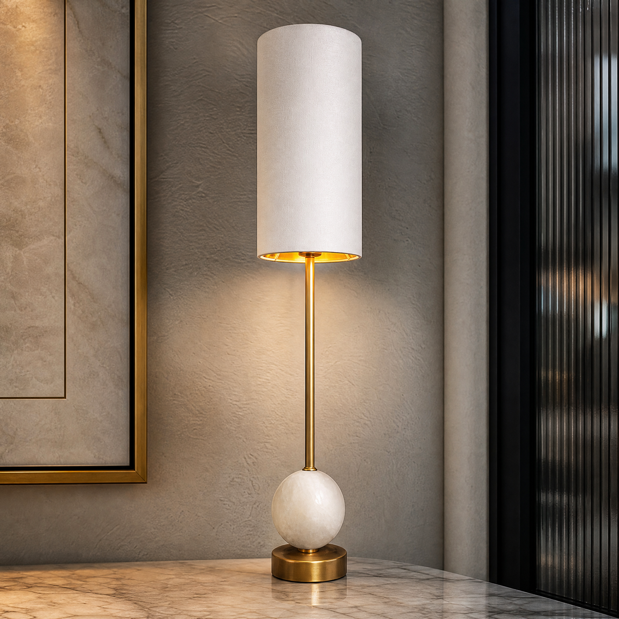 A detailed closeup of the VORELLI Alveron Table Lamp, highlighting the texture of the refined alabaster sphere and the sleek brushed brass accents.