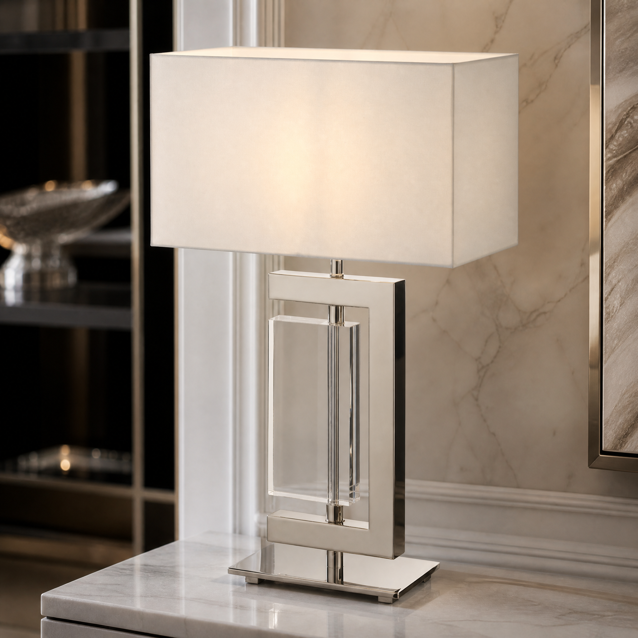 Close-up detail of the VORELLI Alvion table lamp showcasing the sleek architectural lines of the polished nickel frame and refined crystal accents.