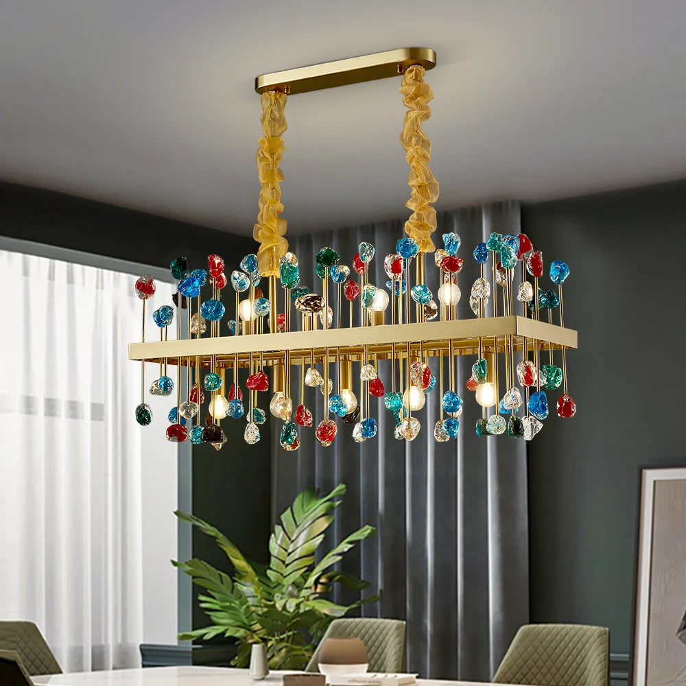 Side view of the Alytus chandelier featuring multicoloured crystal cubes and a rectangular gold frame.