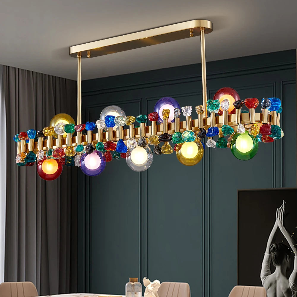 Alytus Rectangular Chandelier II with multicoloured crystal cubes hanging over a luxury dining table.