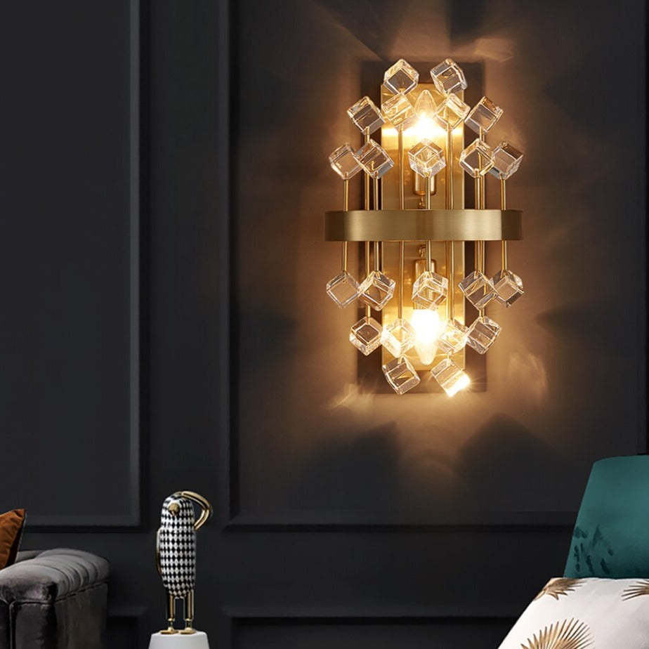 Alytus Wall Light casting a warm, inviting glow in an upscale bedroom setting.