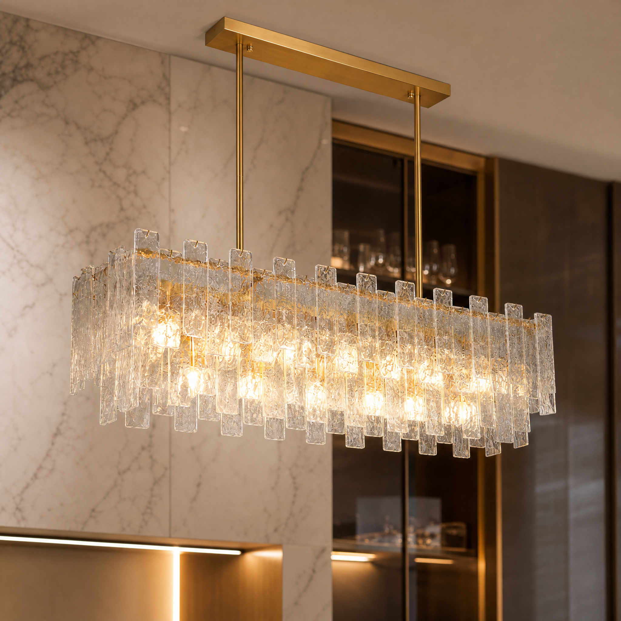 Macro closeup of the VORELLI Ambani chandelier highlighting the unique layered cracked glass panels shimmering with warm light.
