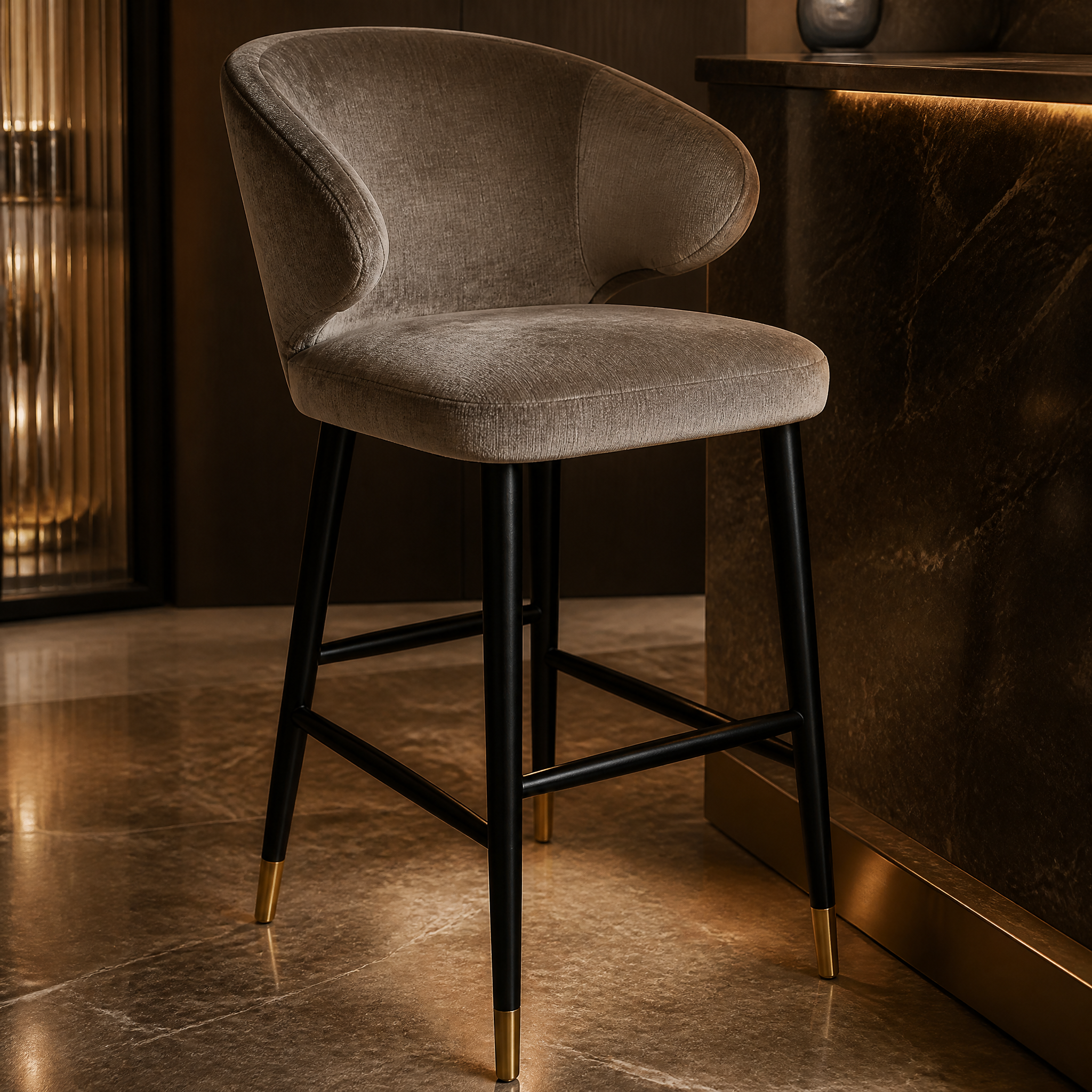 Detailed close-up of the elegant curved lines, warm brass finish trim, and premium soft mouse fabric on the VORELLI Arevo bar stool.