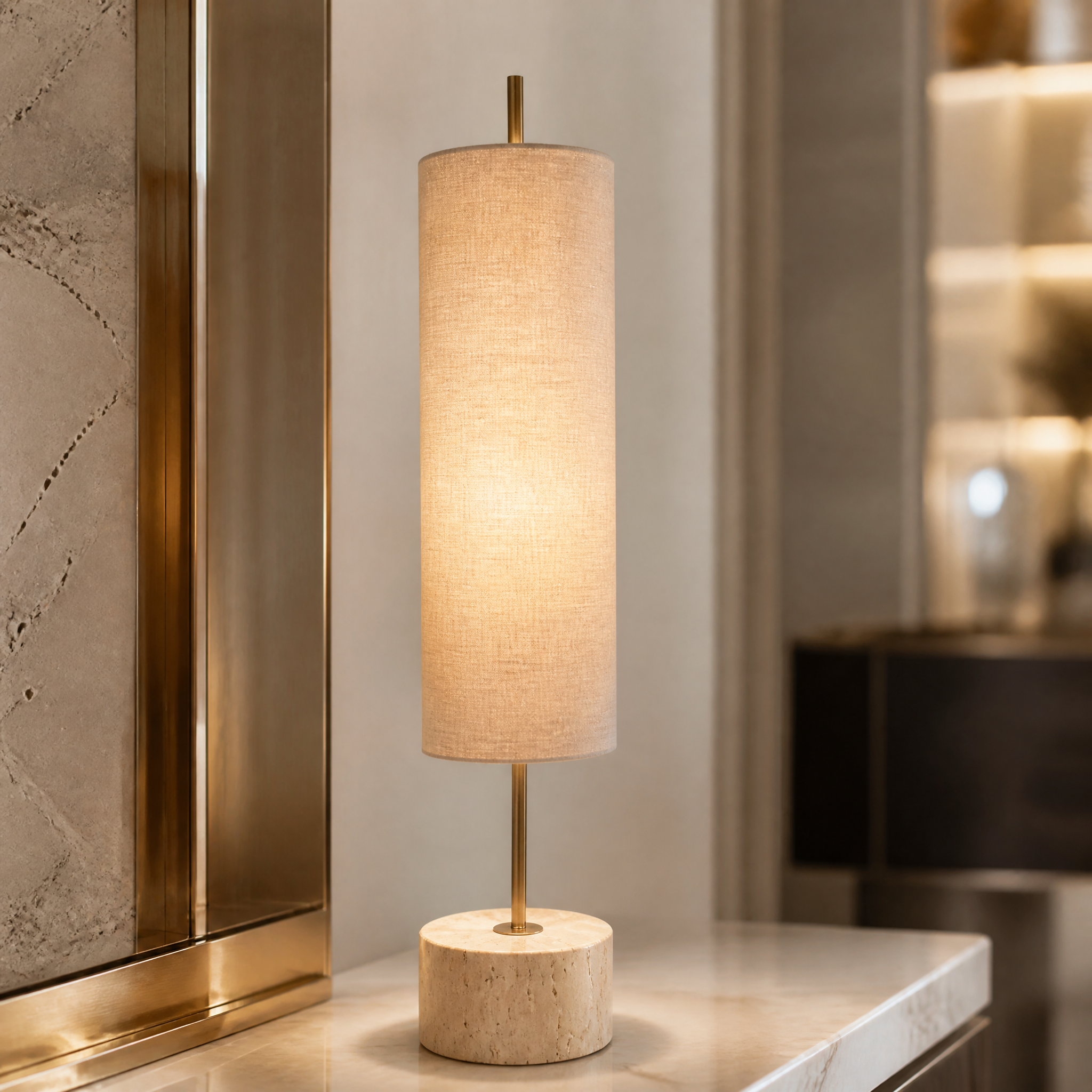 A detailed closeup of the VORELLI Arvane lamp showcasing the textured natural travertine stone base, slender antique brass stem, and premium cylindrical fabric shade.