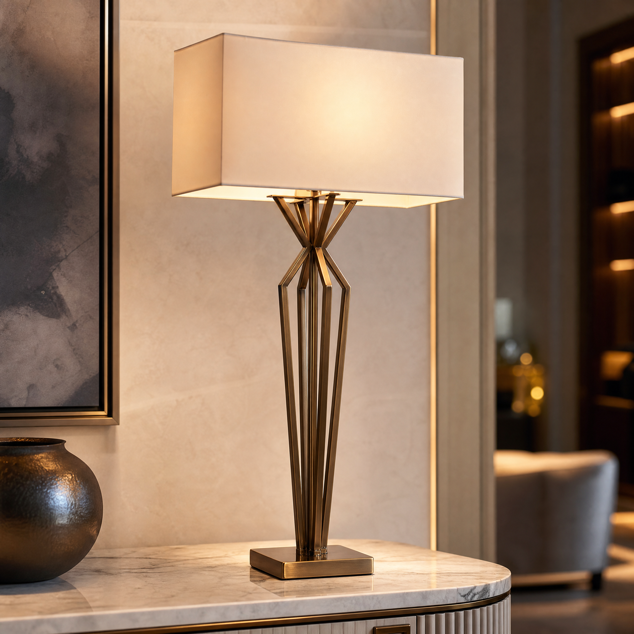 A macro close-up shot focusing on the sculptural open-frame base of the Arvante Table Lamp by VORELLI, highlighting the premium antique brass craftsmanship.