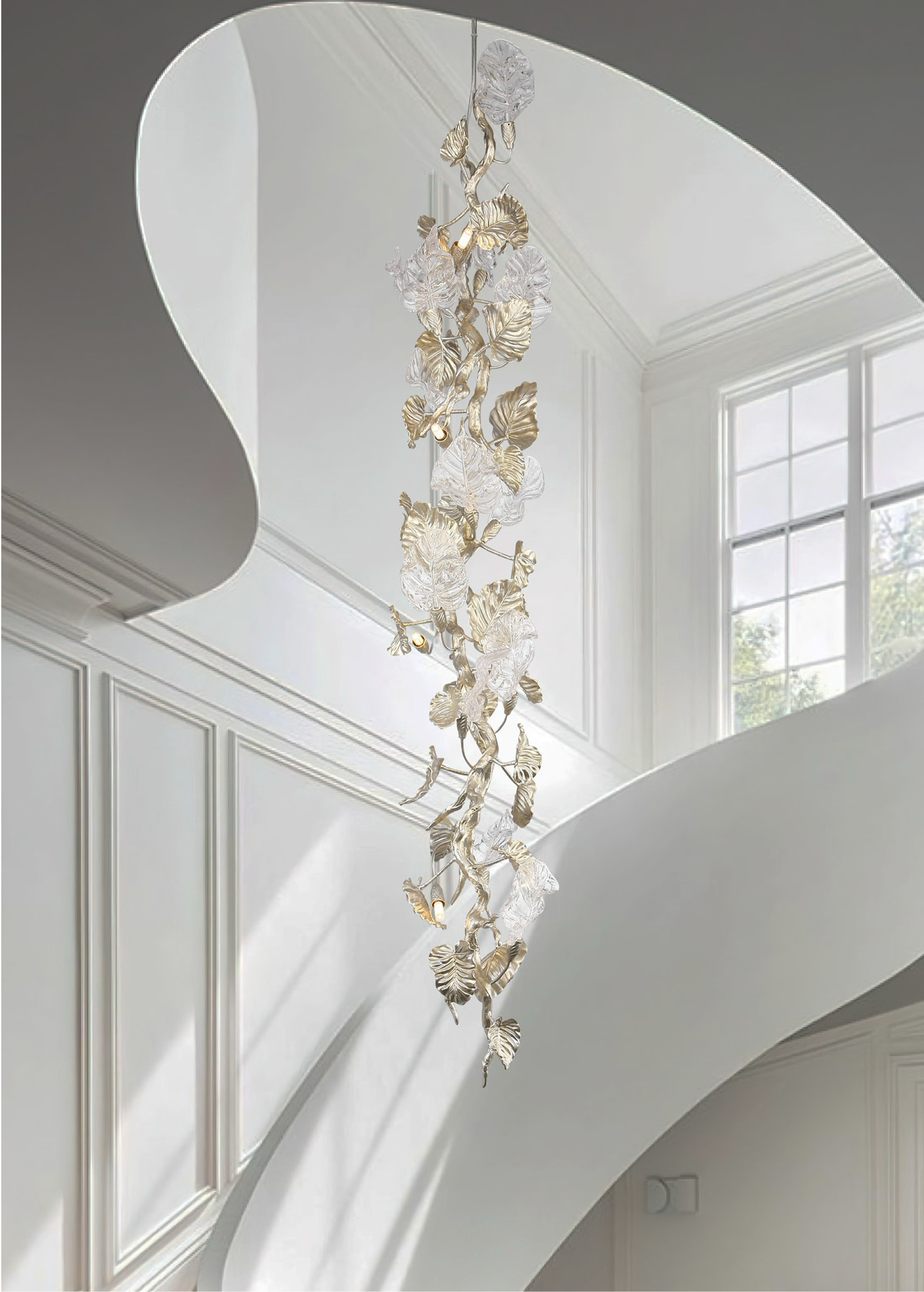 VORELLI® Aura Leaf staircase chandelier with cascading hand-blown glass leaves in a luxury staircase