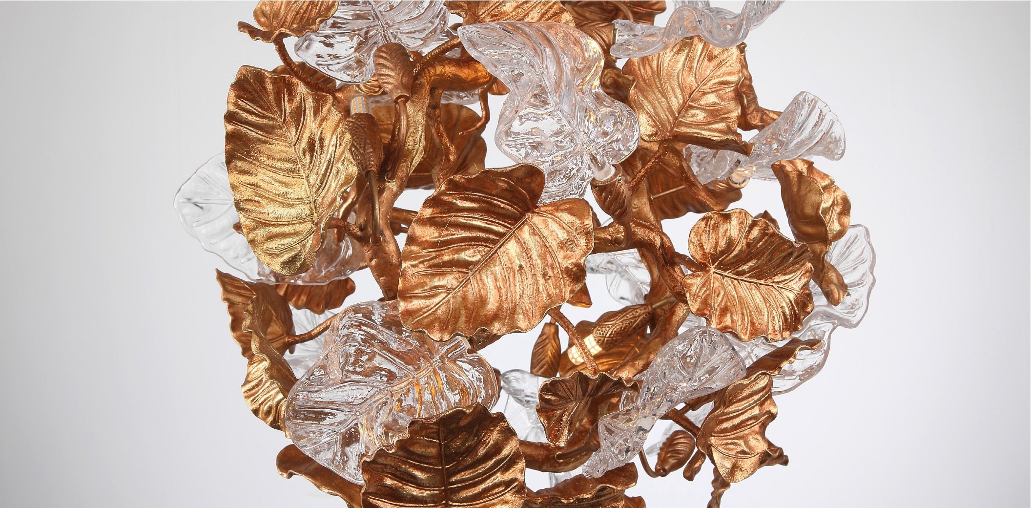 Close-up of the Autumn Bloom Pendant Light highlighting sculpted metallic leaves and crystal accents
