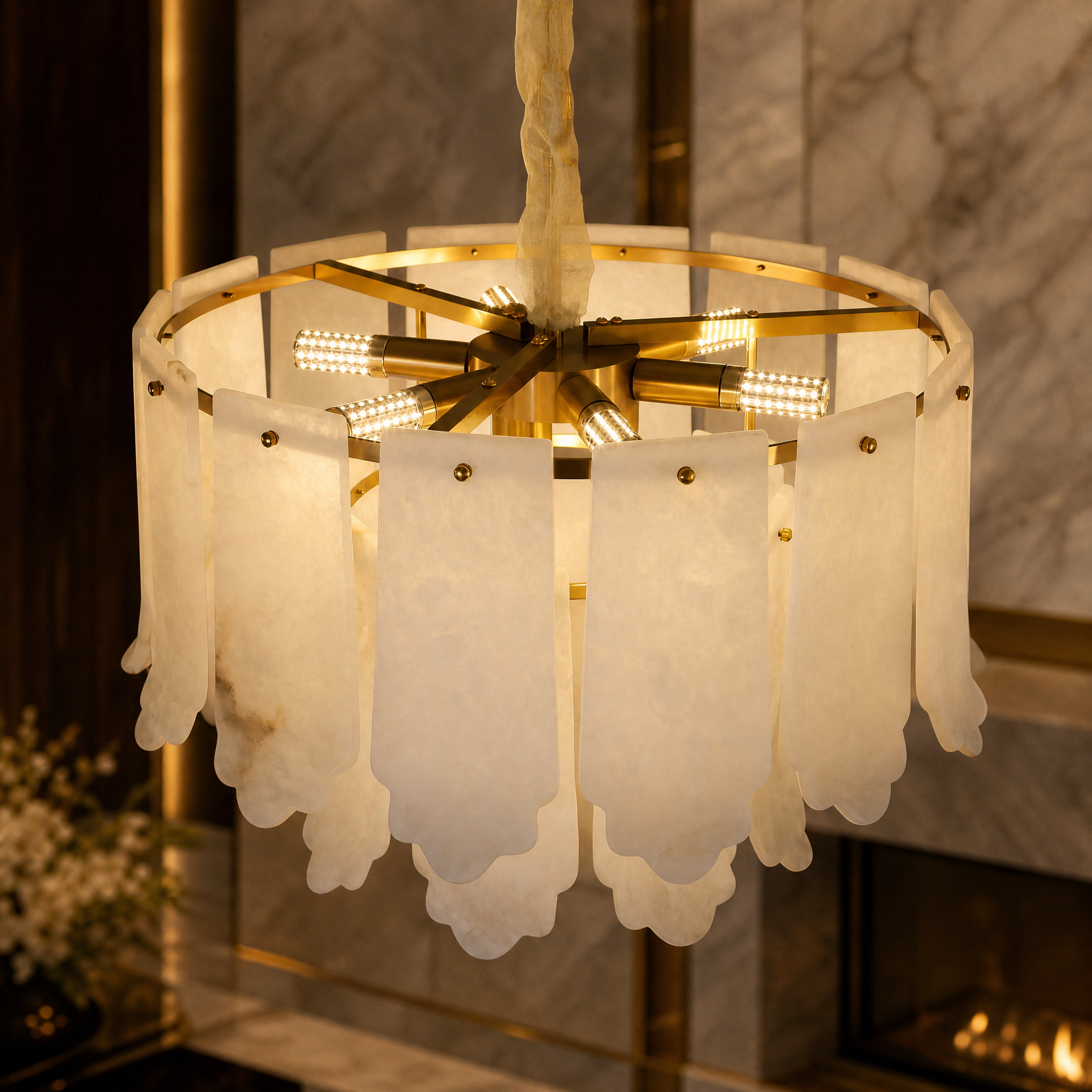 A detailed closeup of the VORELLI Avelina chandelier, highlighting the soft texture and precise craftsmanship of the draped, layered marble panels.
