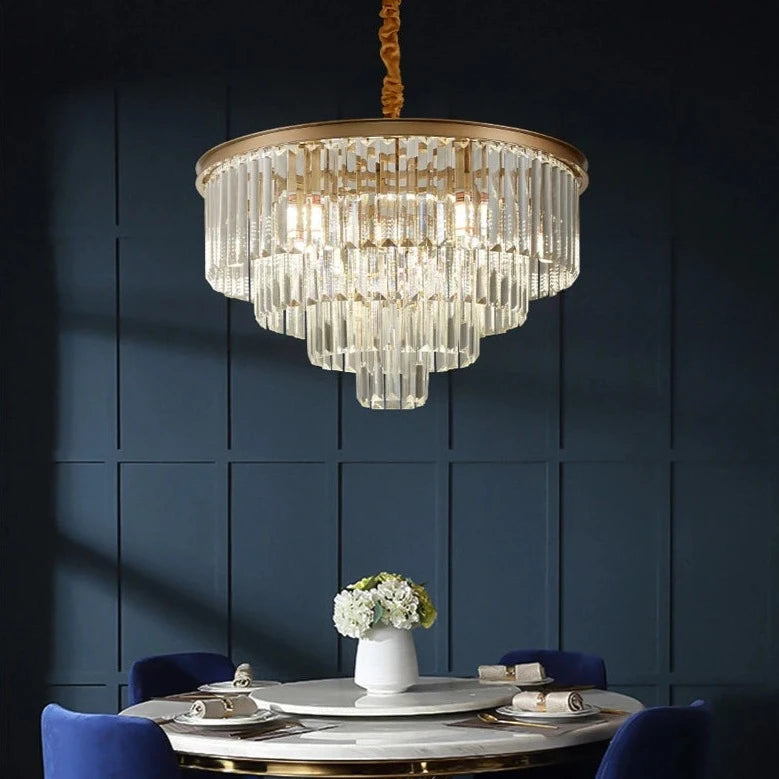 Elegant circular crystal chandelier creating a warm ambience in a dining area.
