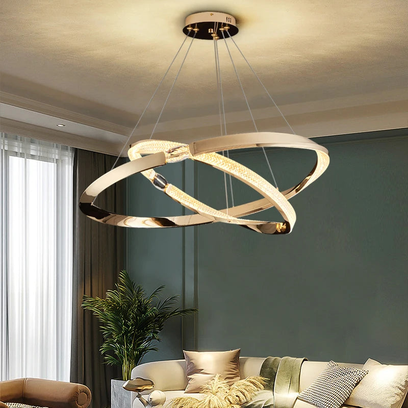Luxury double-ring chandelier with crystal accents illuminating a modern living space.