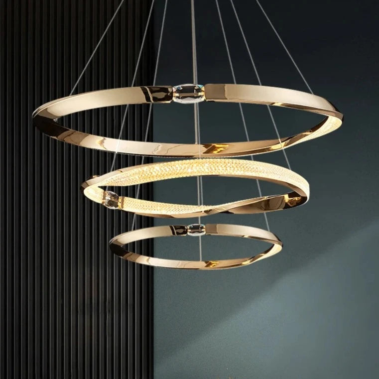 Three circular tiers suspended in alignment, forming the Belgravia trio chandelier.