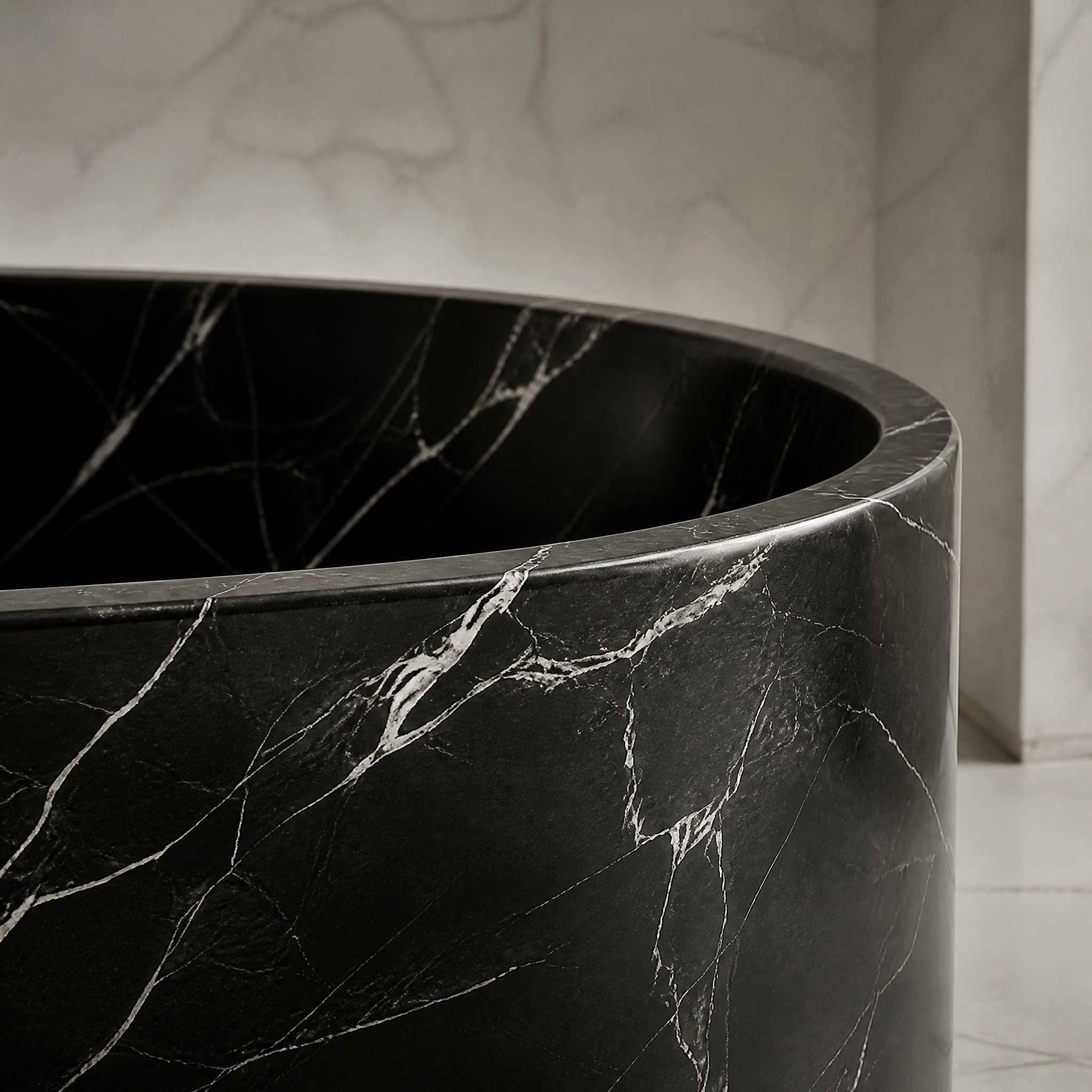 Black Marquina Marble Freestanding Bathtub - Elliptical stone craftsmanship detail image by VORELLI