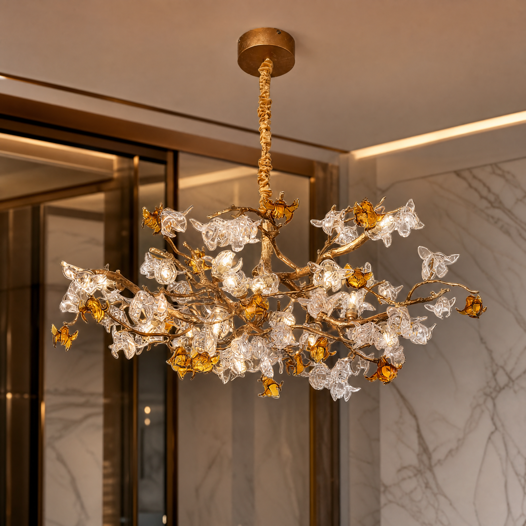 A detailed closeup of the flowing glass petals and refined amber highlights on the VORELLI Bloom Pendant Light.