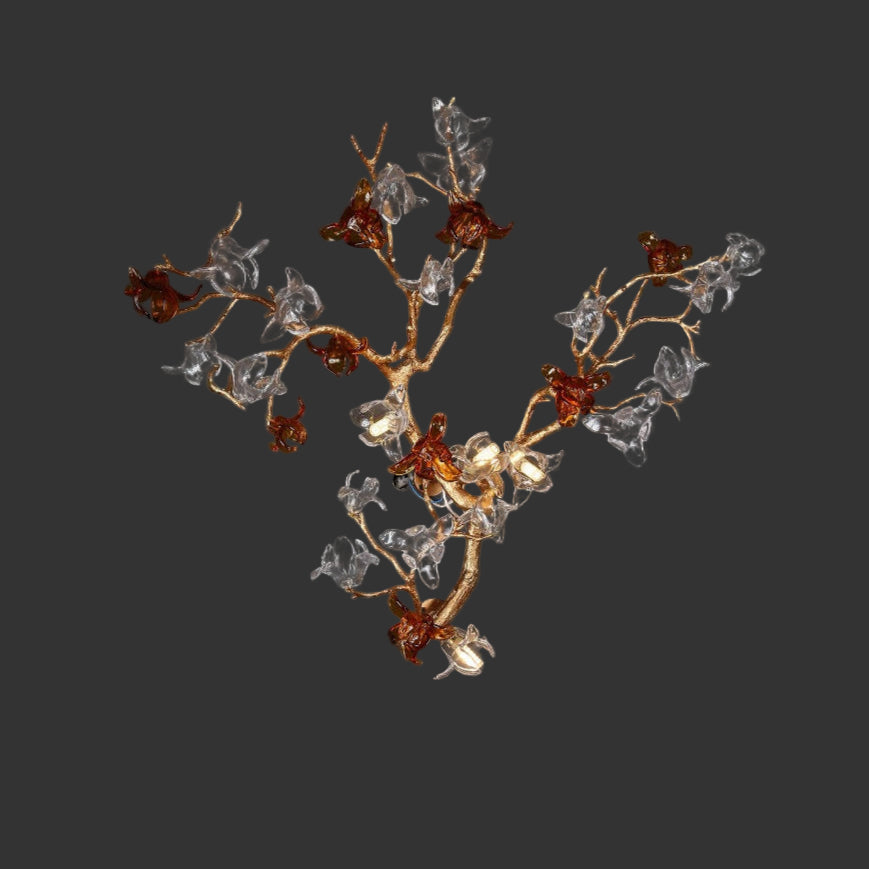 Bloom Wall Light II featuring sculptural branching arms with crystal petals in warm amber and clear tones.