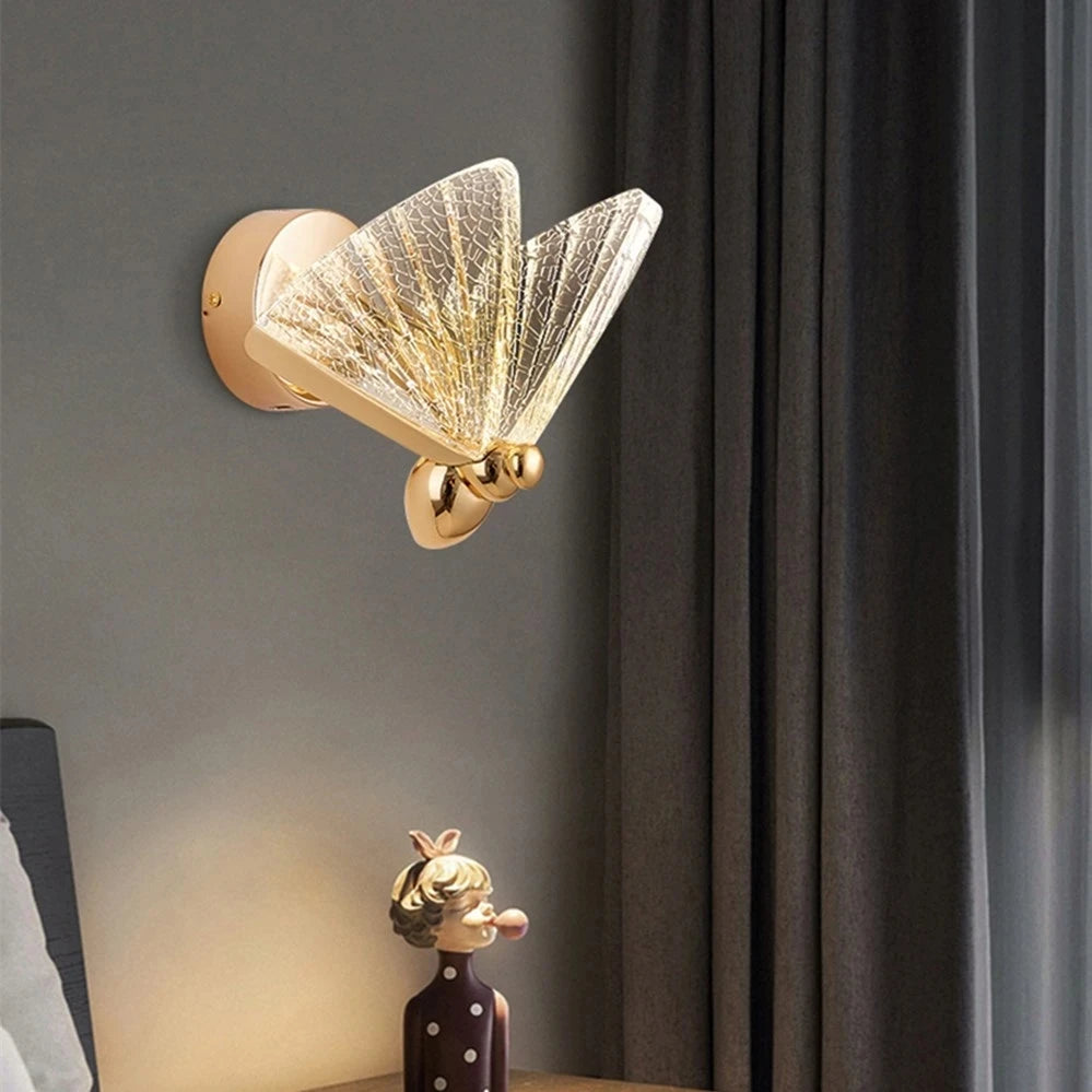 Close-up of the Butterfly Wall Light showing illuminated glass butterfly wings and warm ambient lighting.