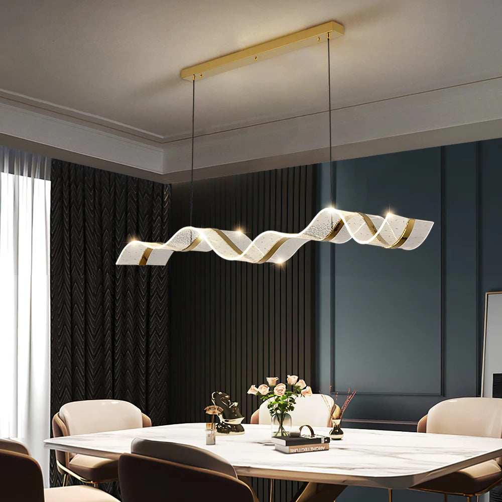 Capitano Rectangular Chandelier with flowing sculptural LED form suspended above a modern dining table.