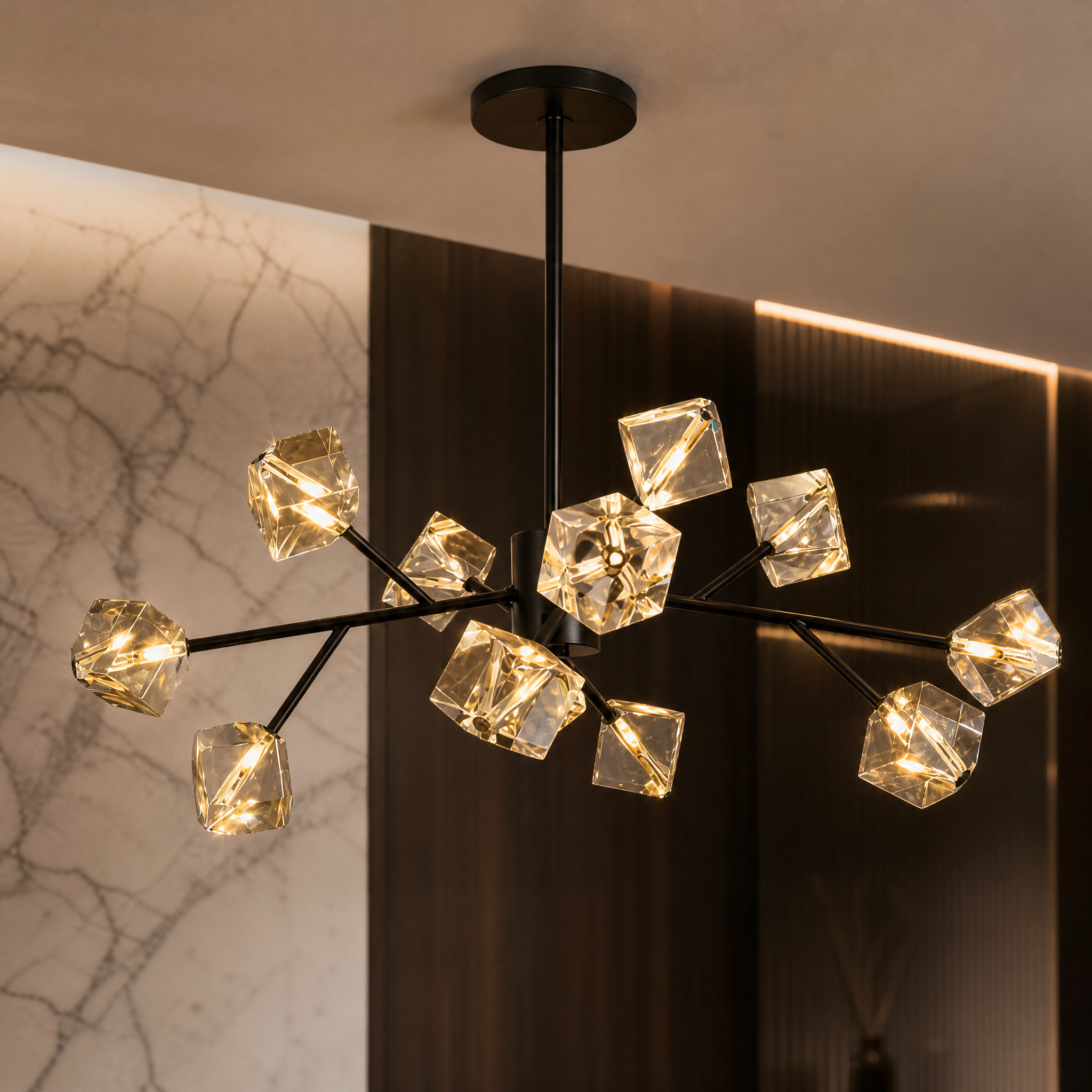 Detailed close-up of the sculpted crystal cubes and sleek contemporary frame on the VORELLI Crenshaw pendant light, showcasing the interplay of light.