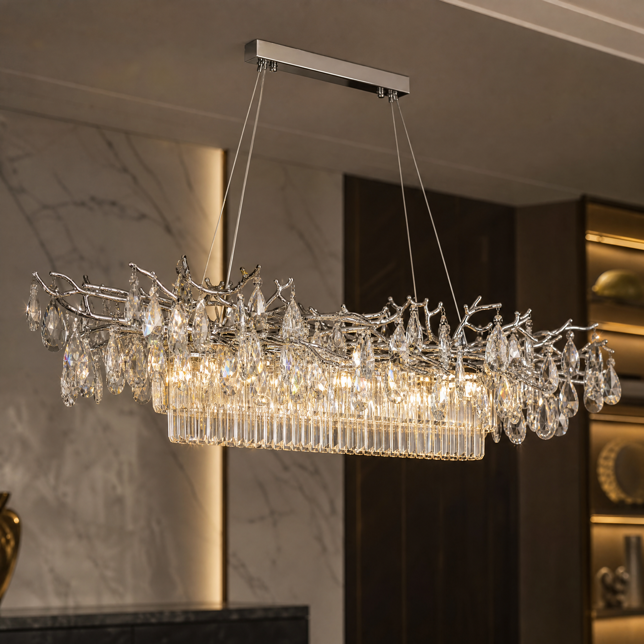 Detailed closeup of the cascading crystal drops and elegant structure on the VORELLI Dewdrop rectangular chandelier.