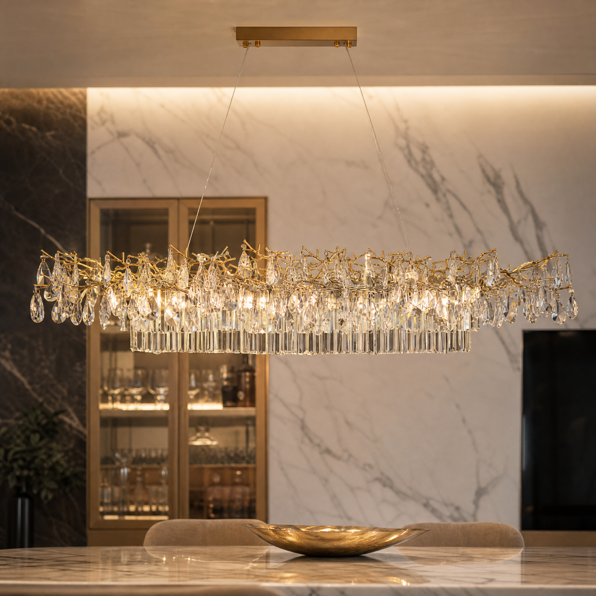 Macro closeup shot of the VORELLI Dewdrop Rectangular Chandelier II, highlighting the intricate teardrop crystals and detailed texture of the gold branch frame.
